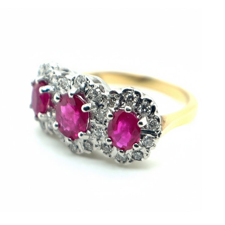 18ct Yellow Gold 3 Stone Ruby with Diamond Halo Ring