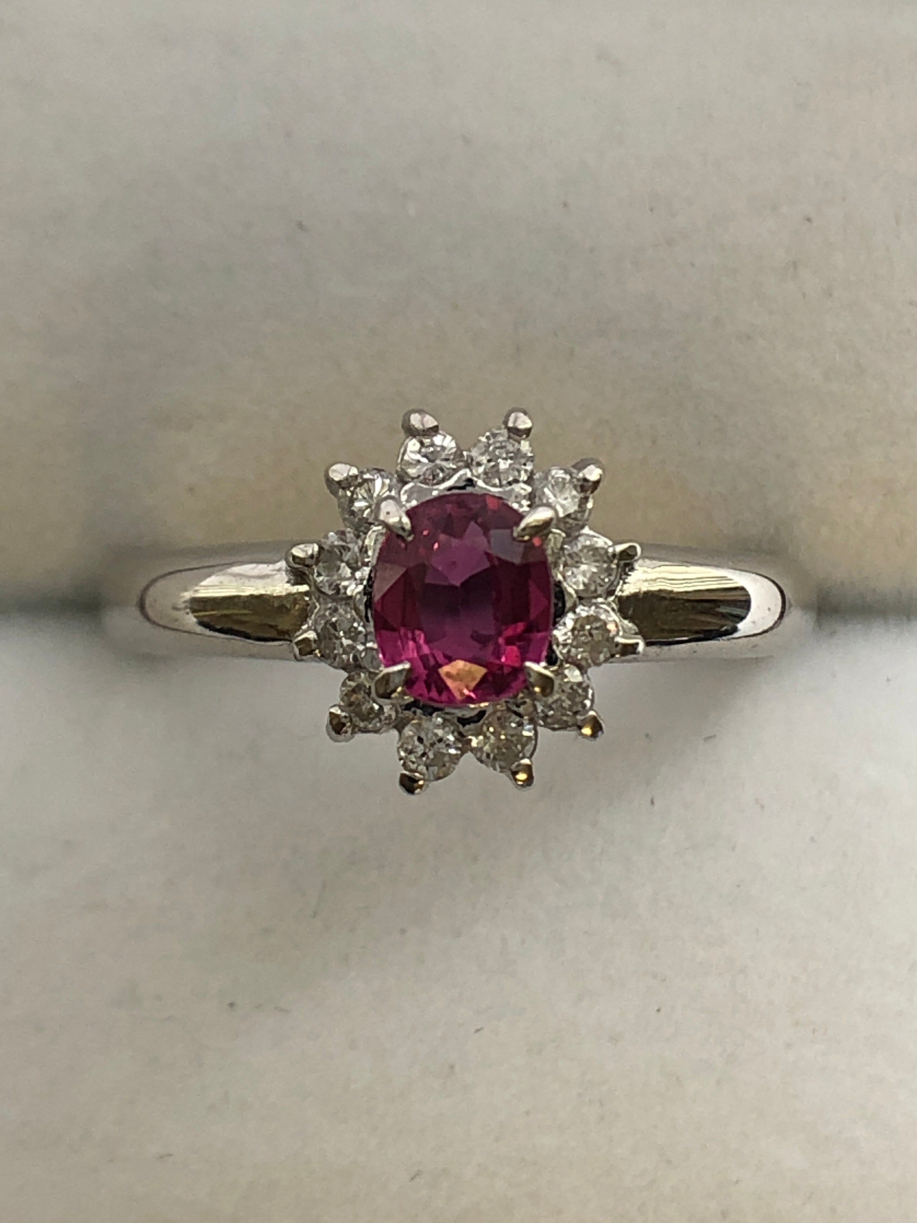 A platinum ruby and diamond cluster ring
