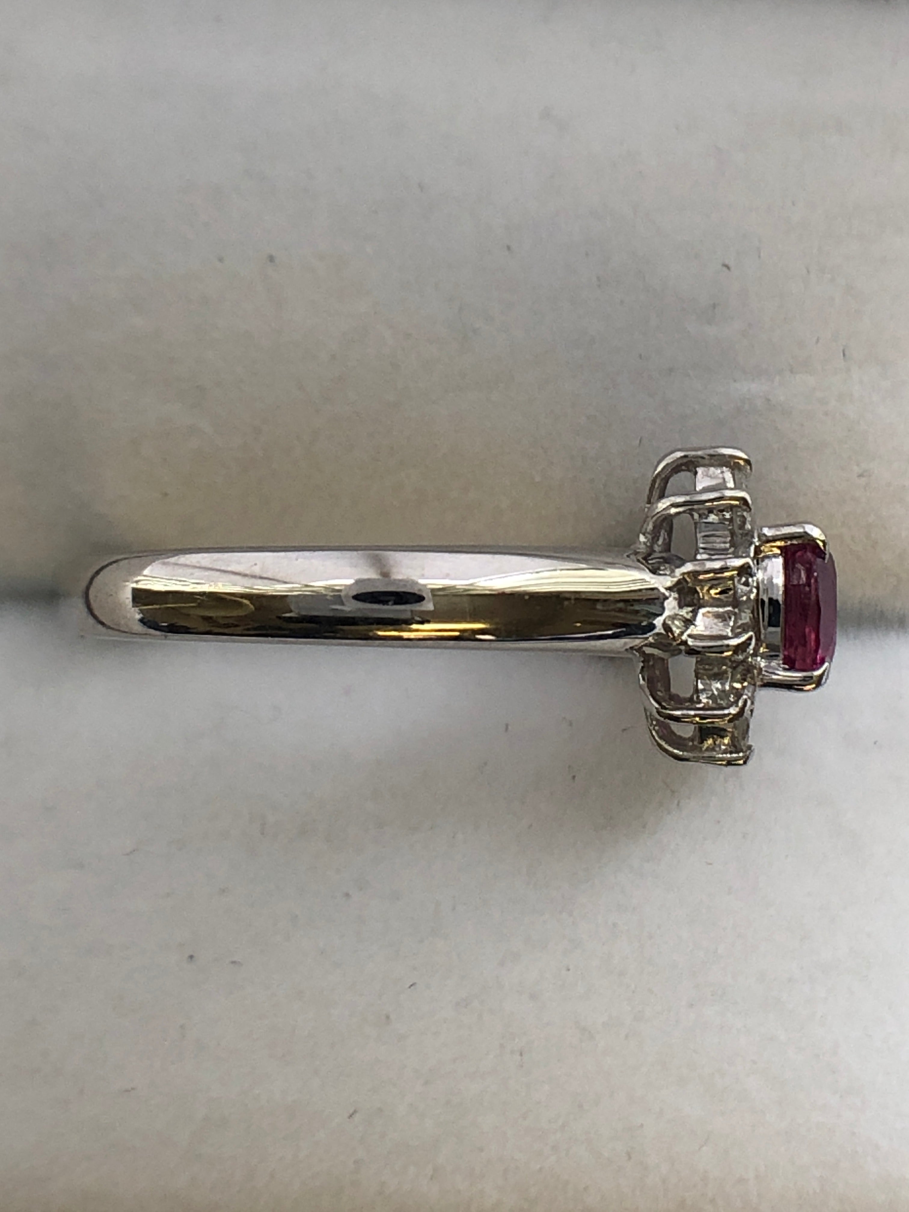 A platinum ruby and diamond cluster ring