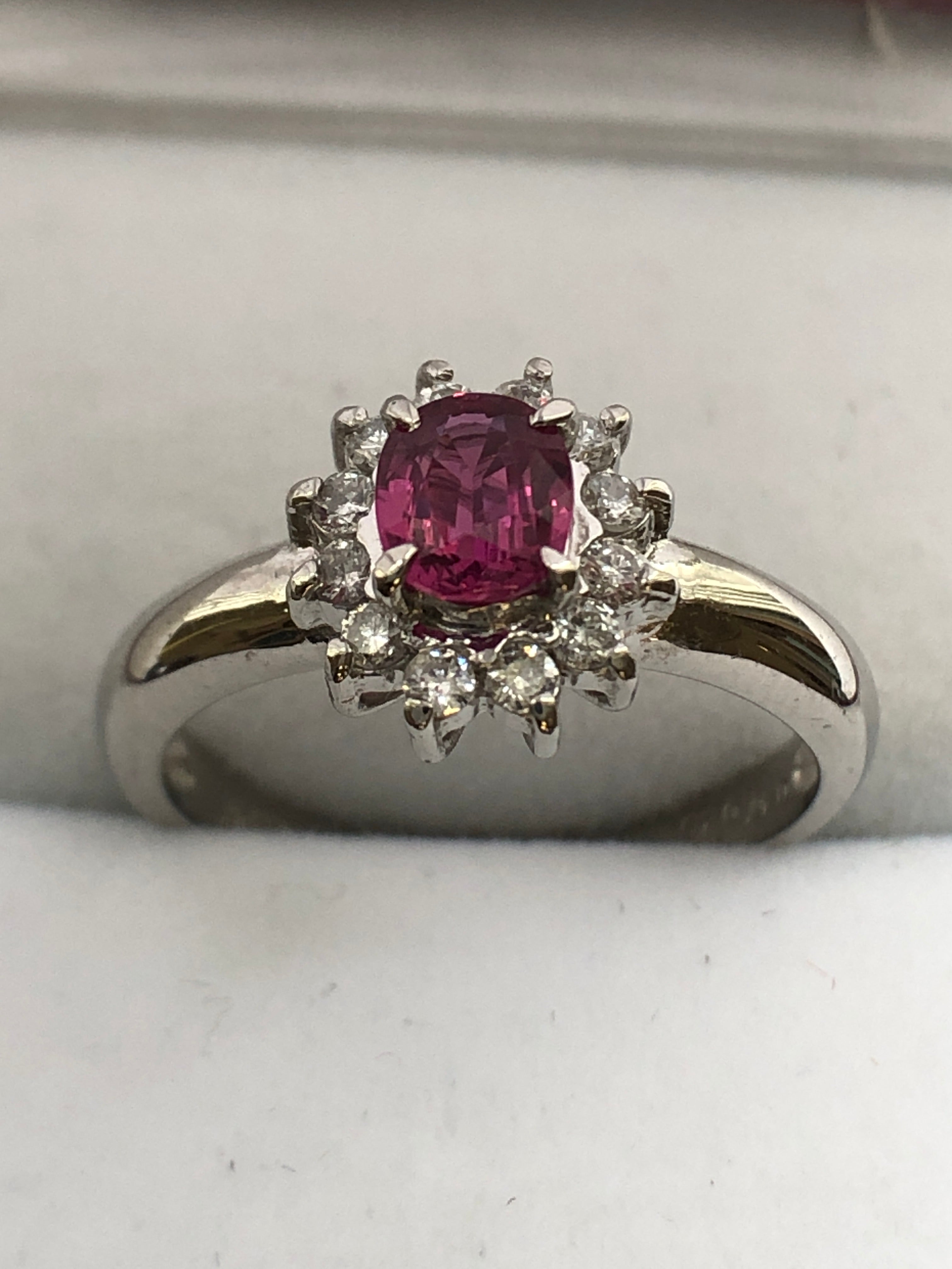 A platinum ruby and diamond cluster ring