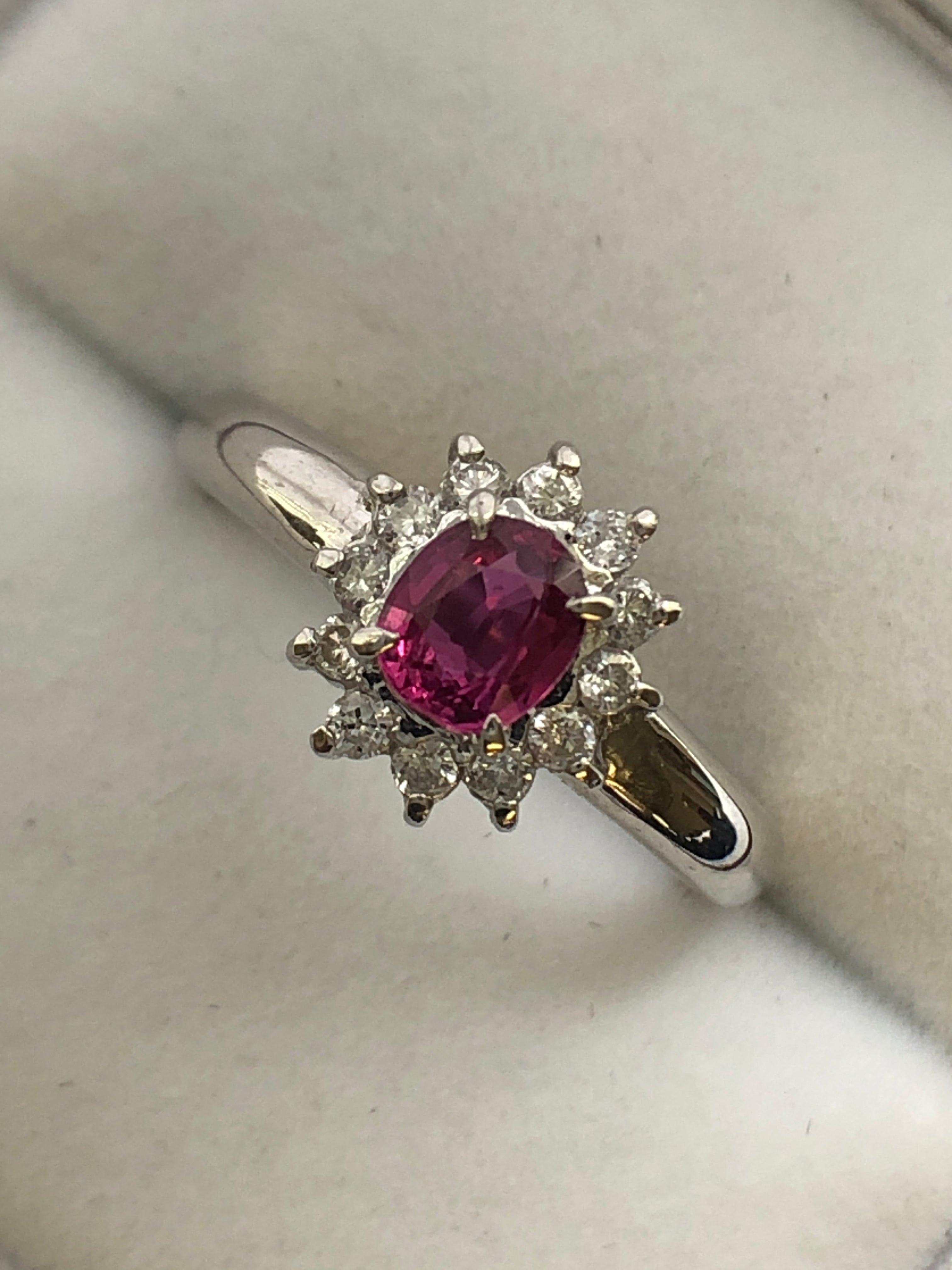 A platinum ruby and diamond cluster ring