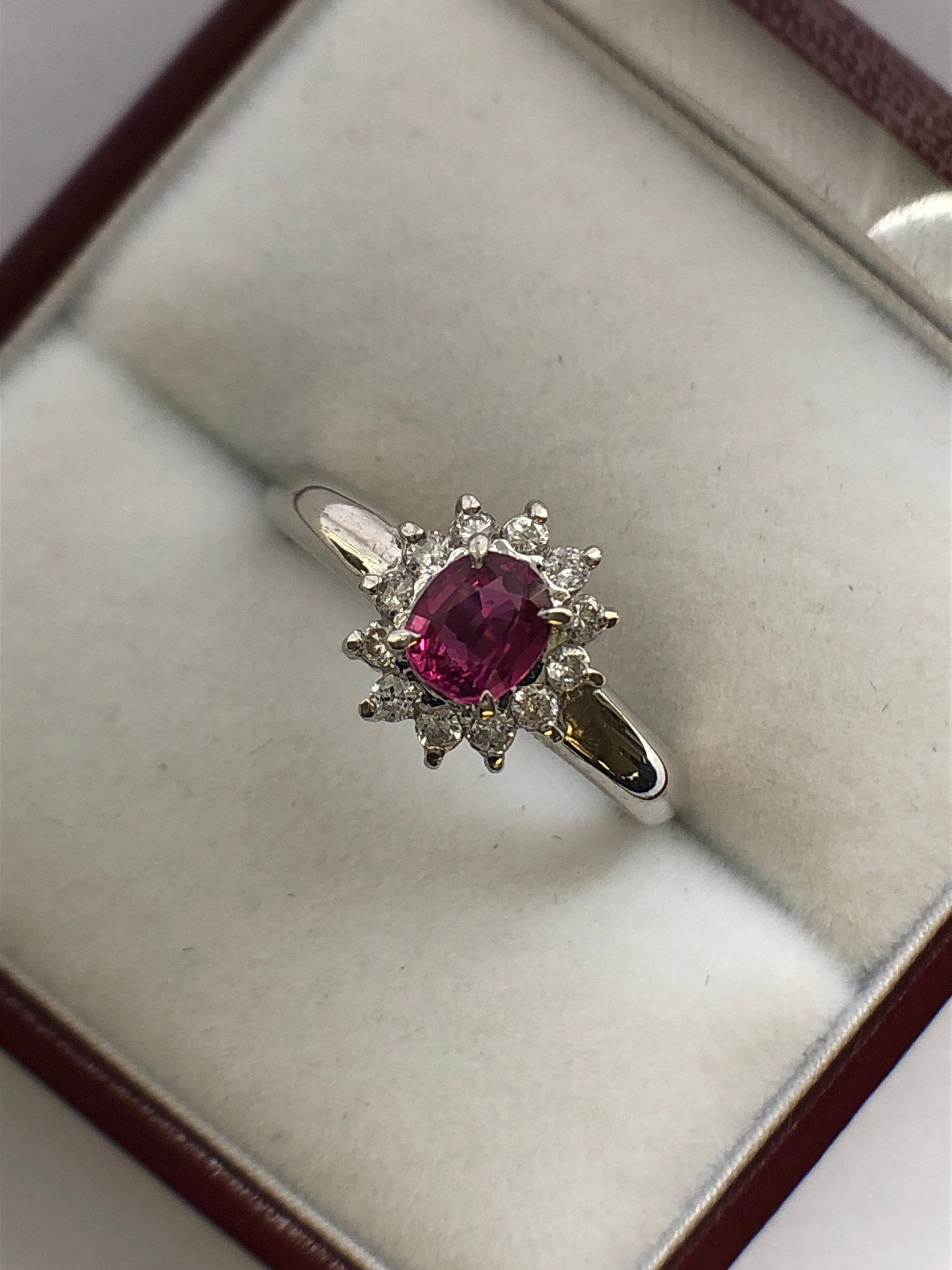 A platinum ruby and diamond cluster ring