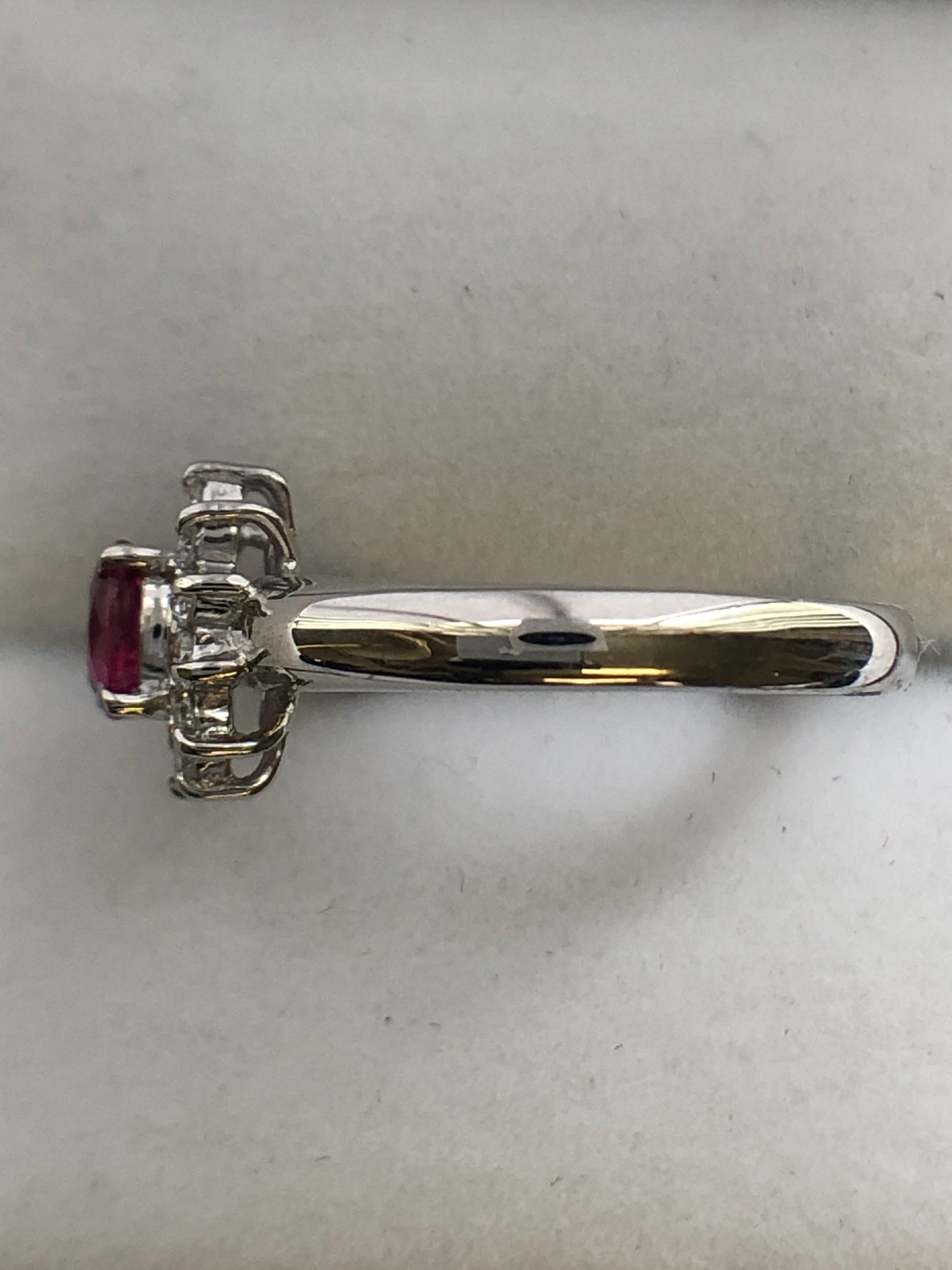 A platinum ruby and diamond cluster ring