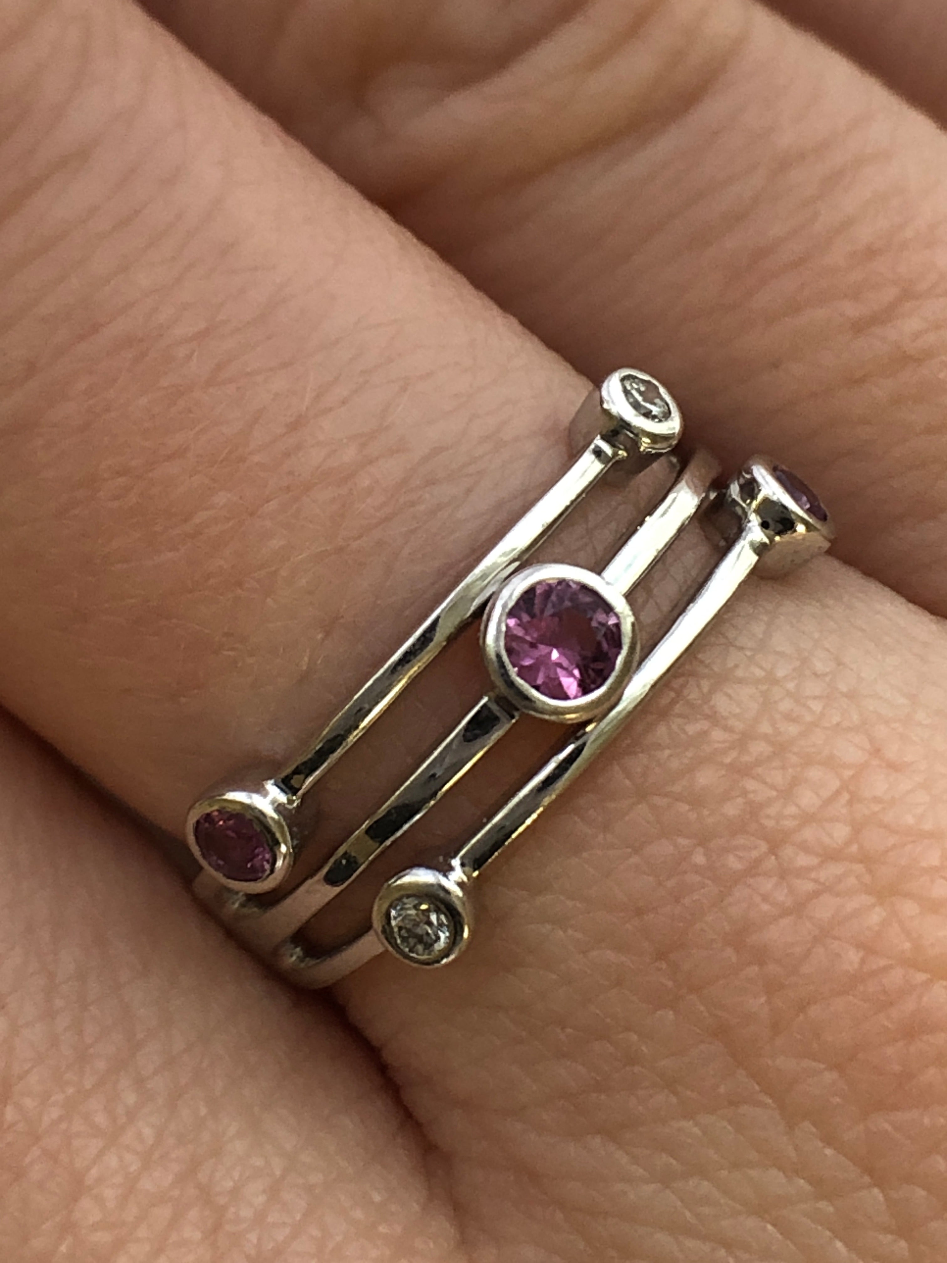 An 18ct white gold pink sapphire and diamond ring