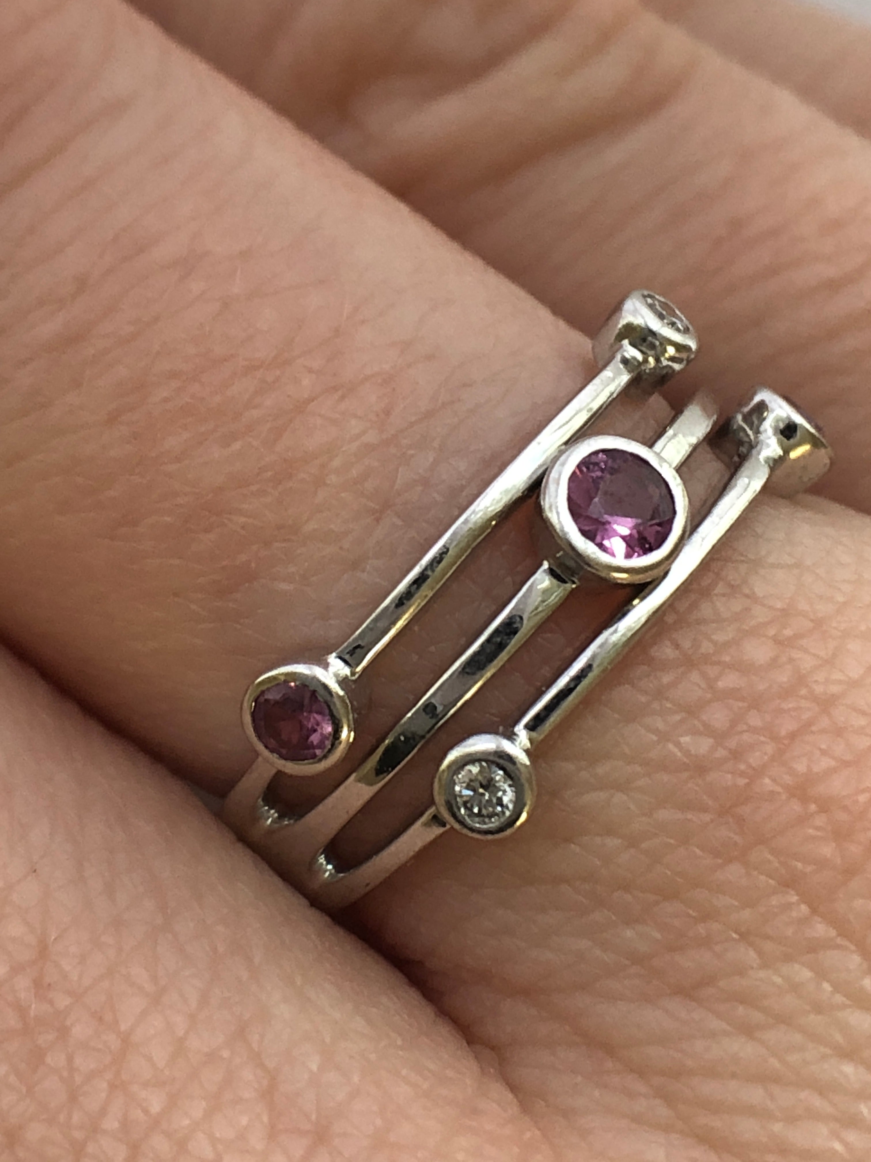 An 18ct white gold pink sapphire and diamond ring