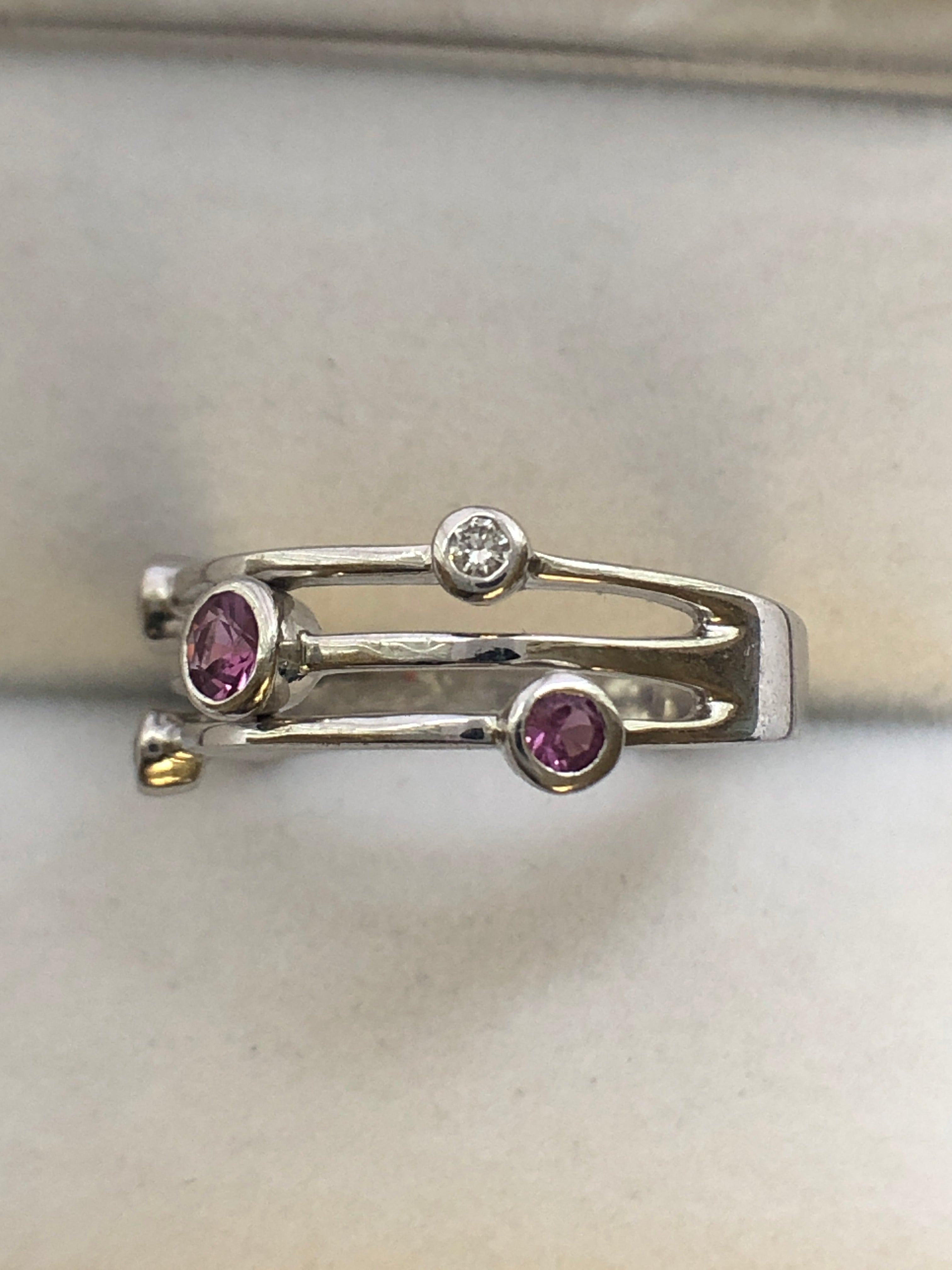 An 18ct white gold pink sapphire and diamond ring