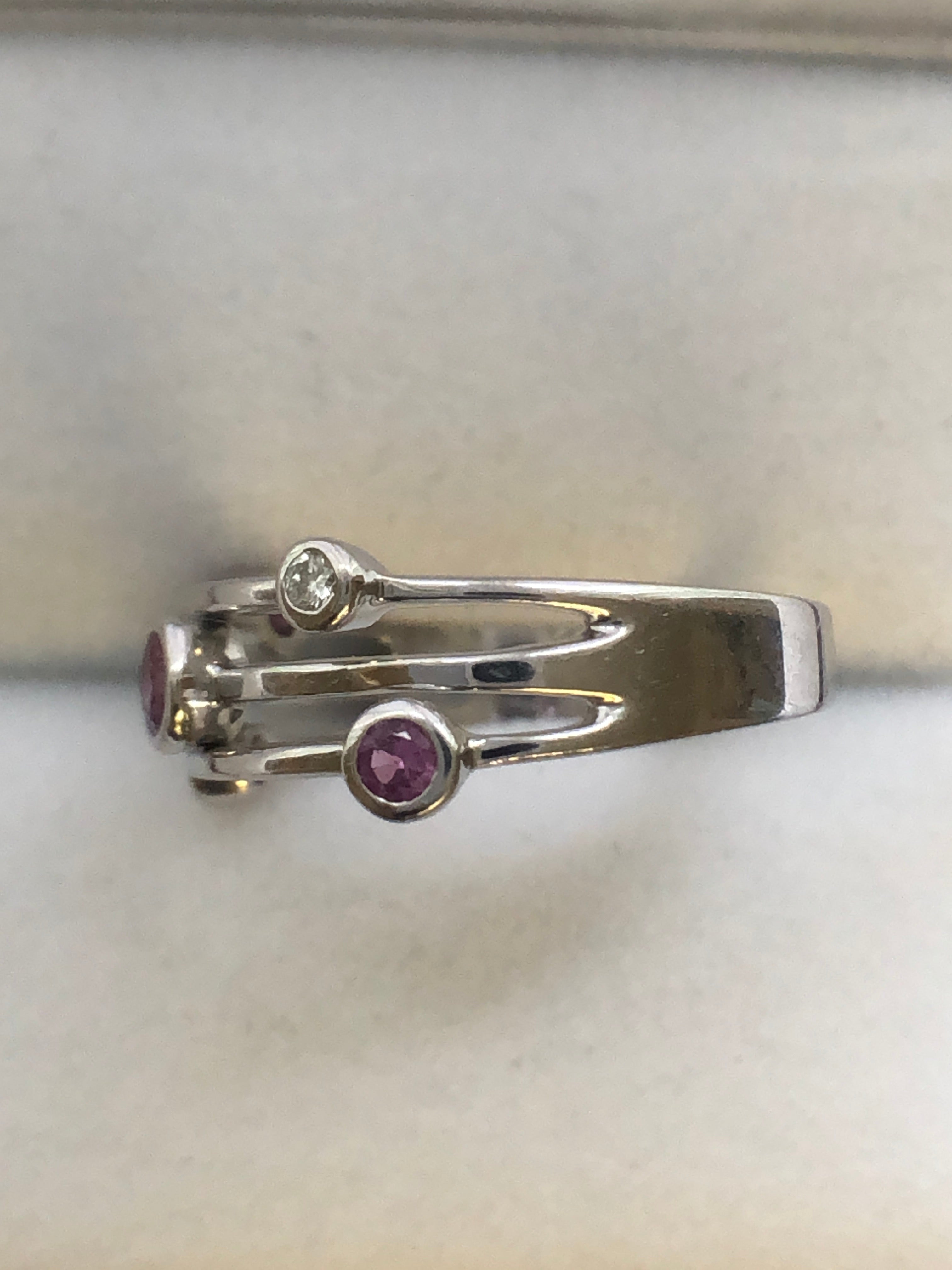 An 18ct white gold pink sapphire and diamond ring