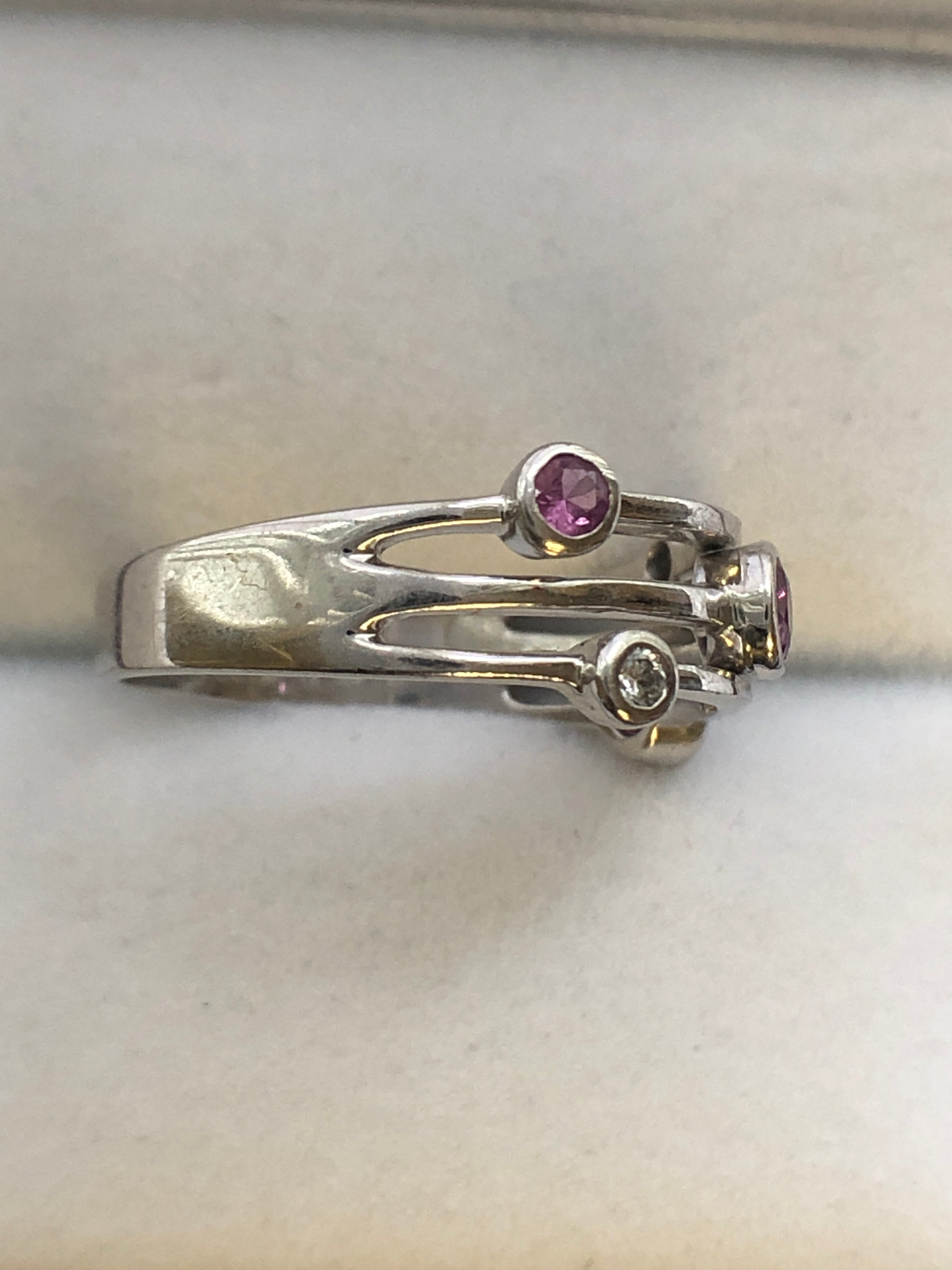 An 18ct white gold pink sapphire and diamond ring