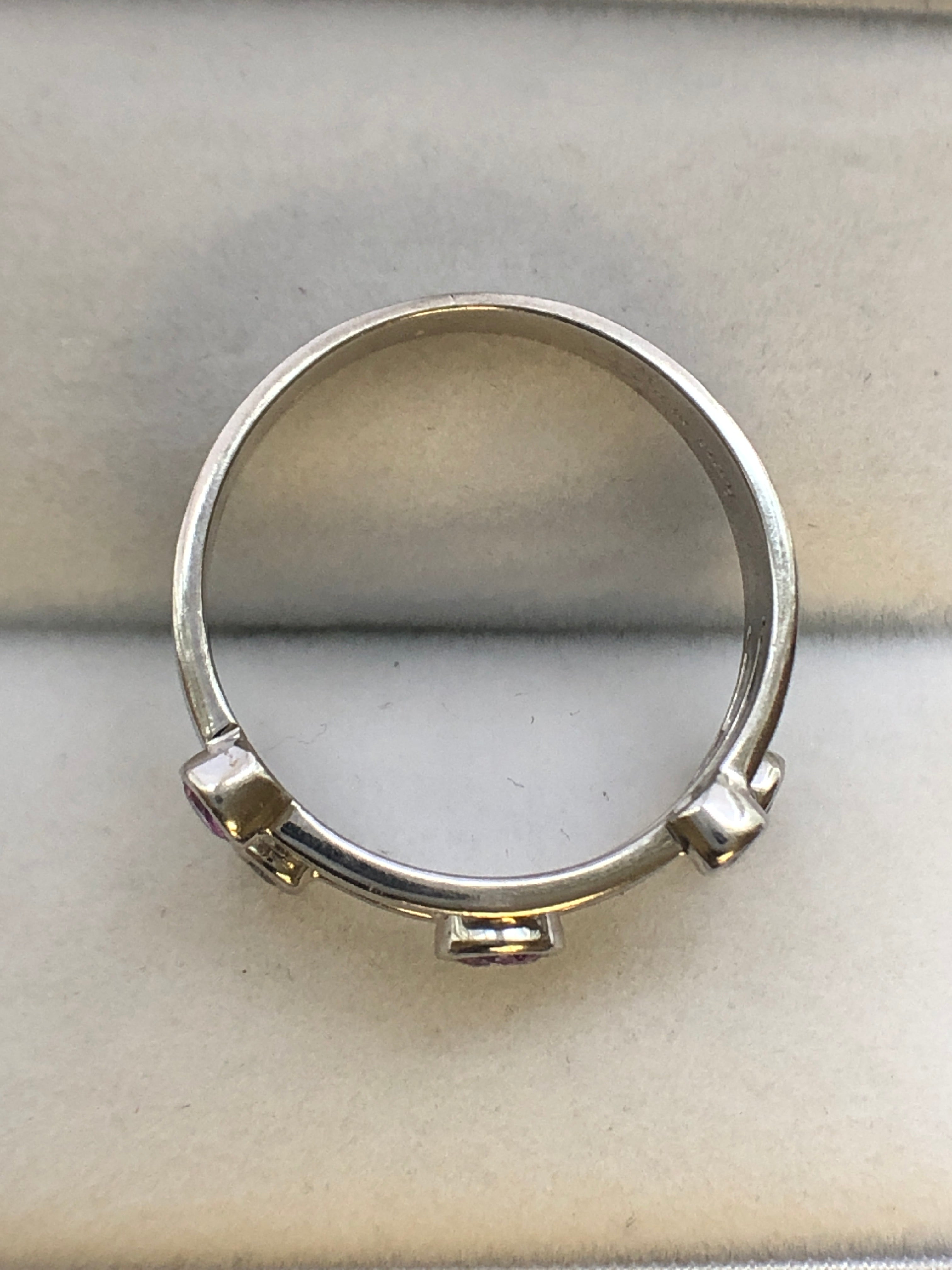 An 18ct white gold pink sapphire and diamond ring