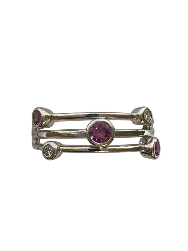 An 18ct white gold pink sapphire and diamond ring