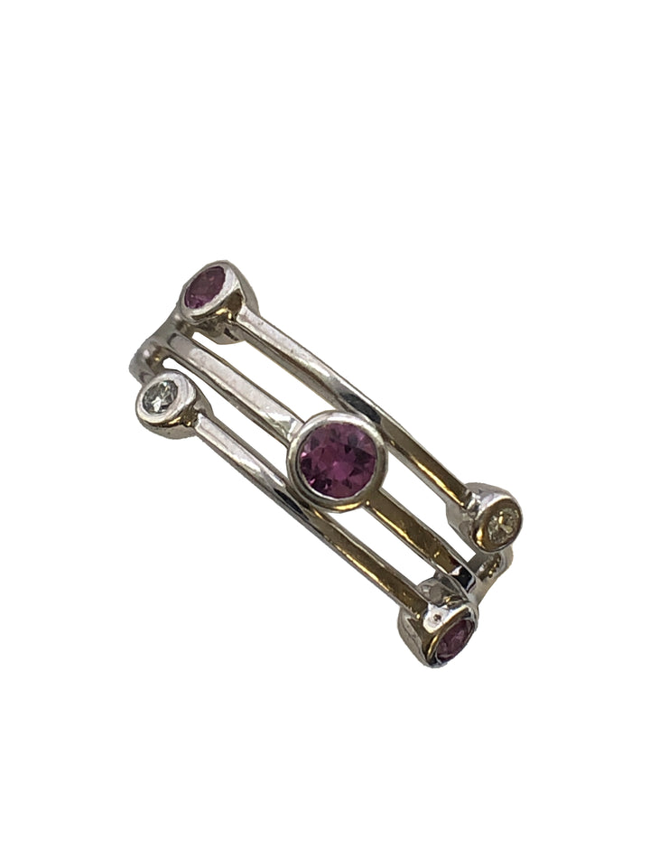 An 18ct white gold pink sapphire and diamond ring