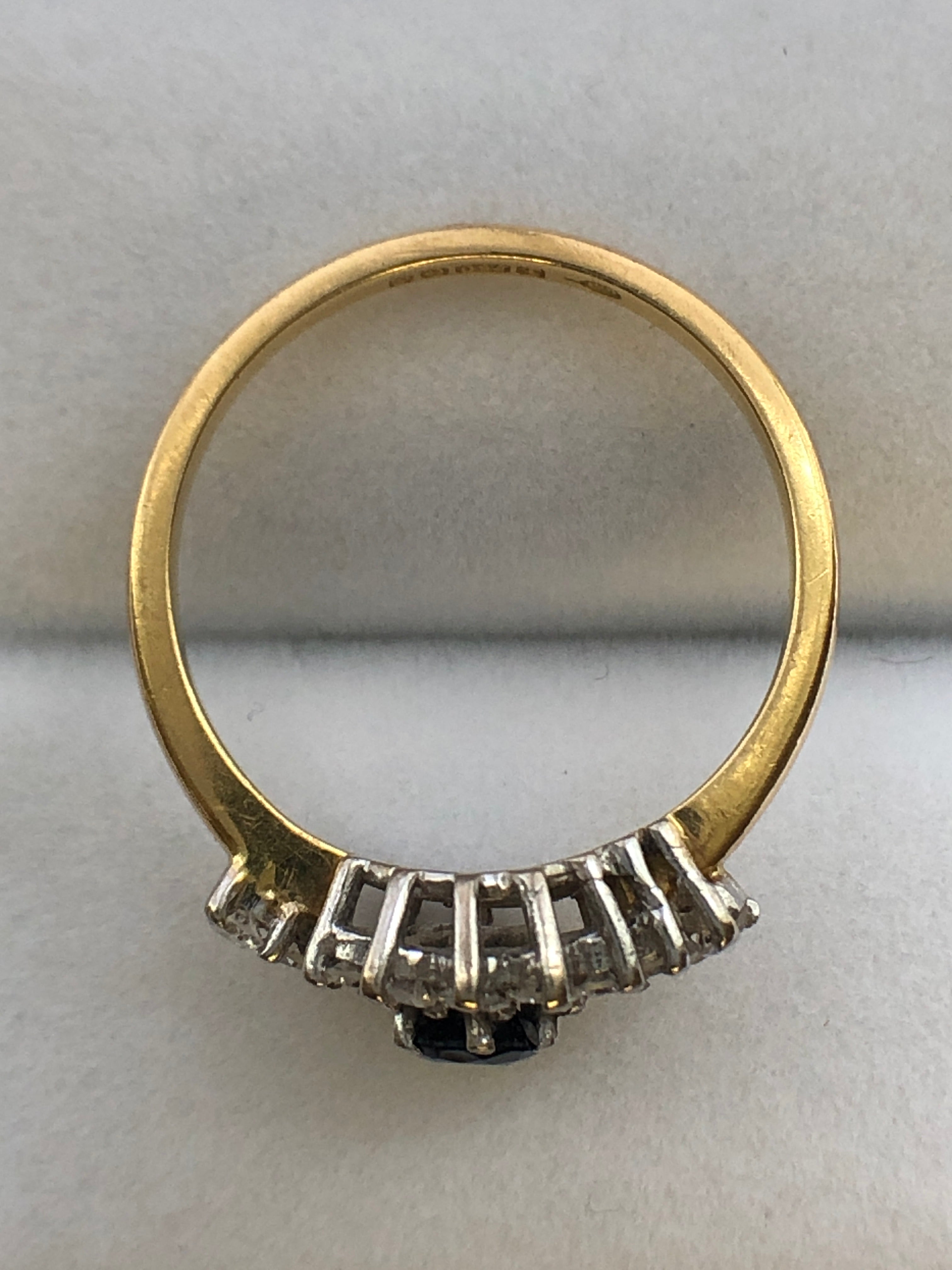 An 18ct gold sapphire and diamond ring