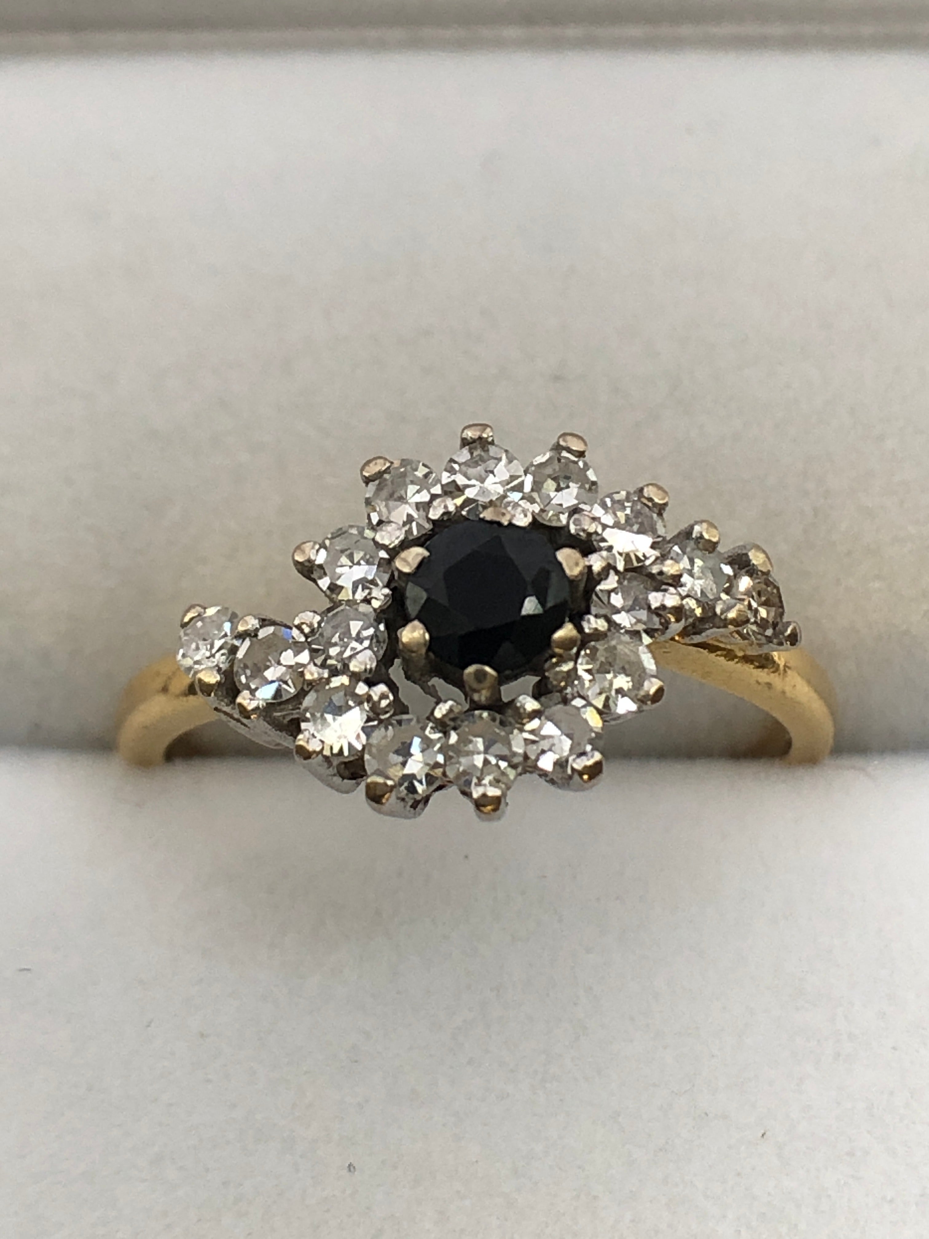 An 18ct gold sapphire and diamond ring
