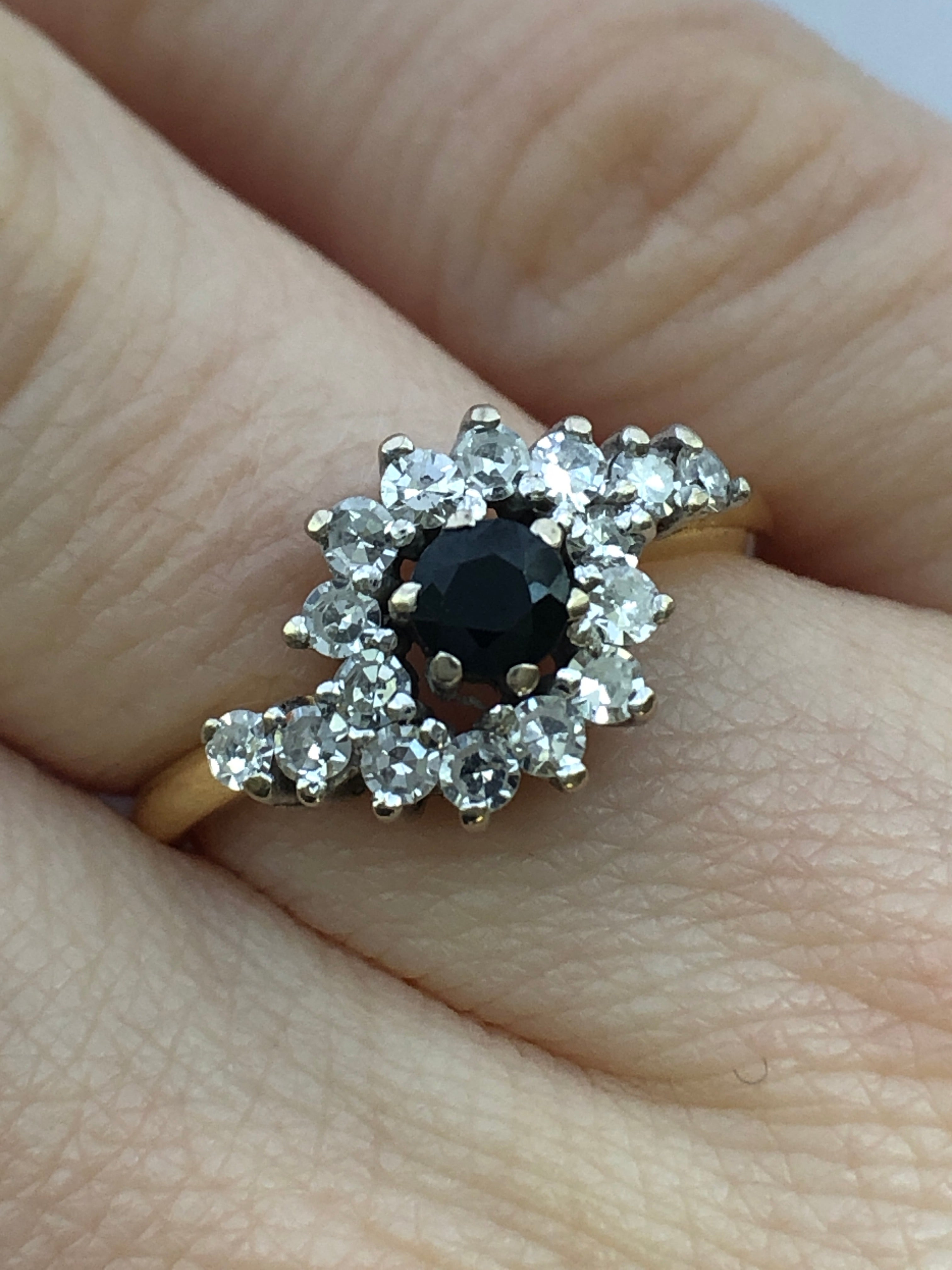 An 18ct gold sapphire and diamond ring