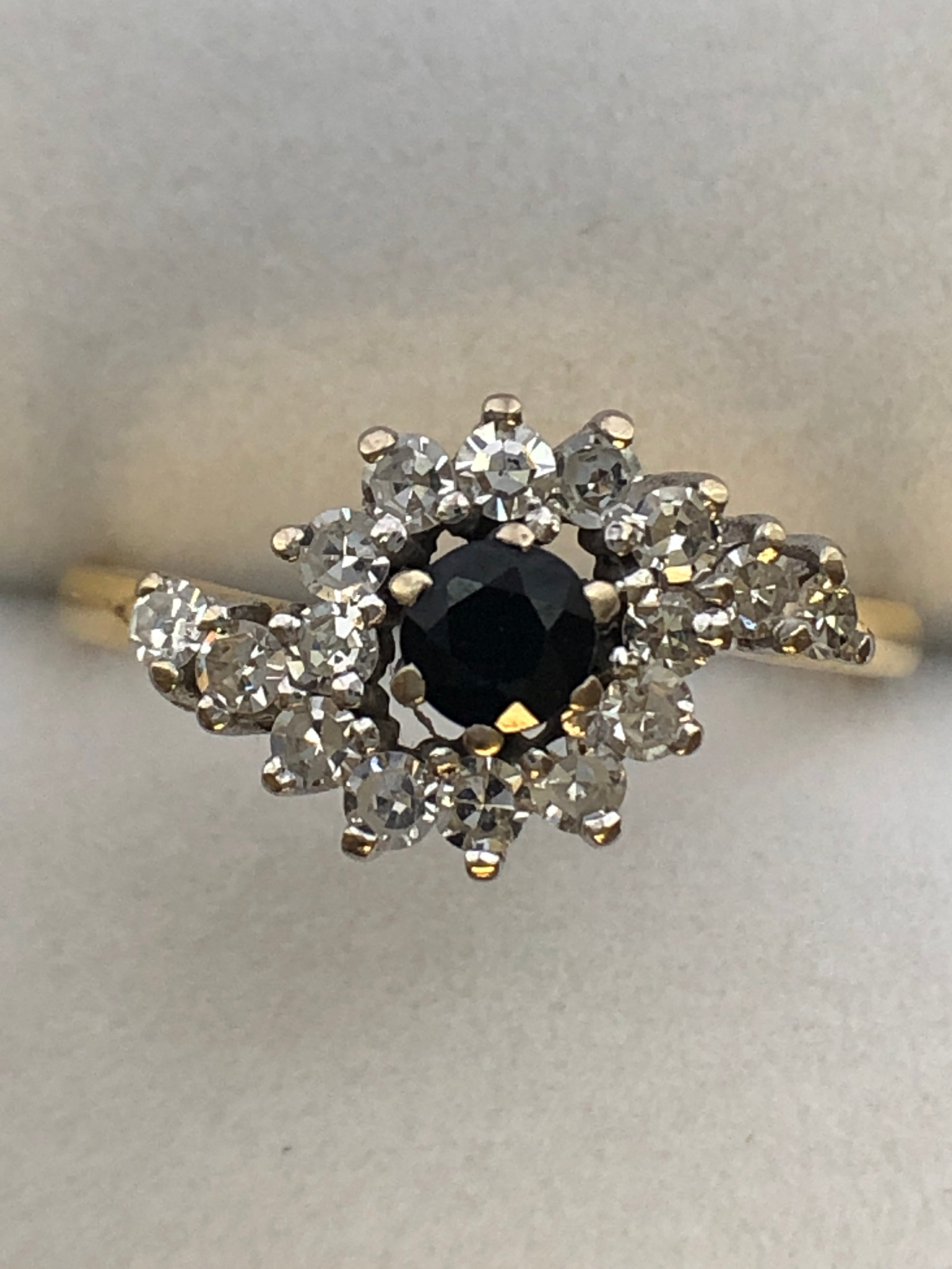 An 18ct gold sapphire and diamond ring