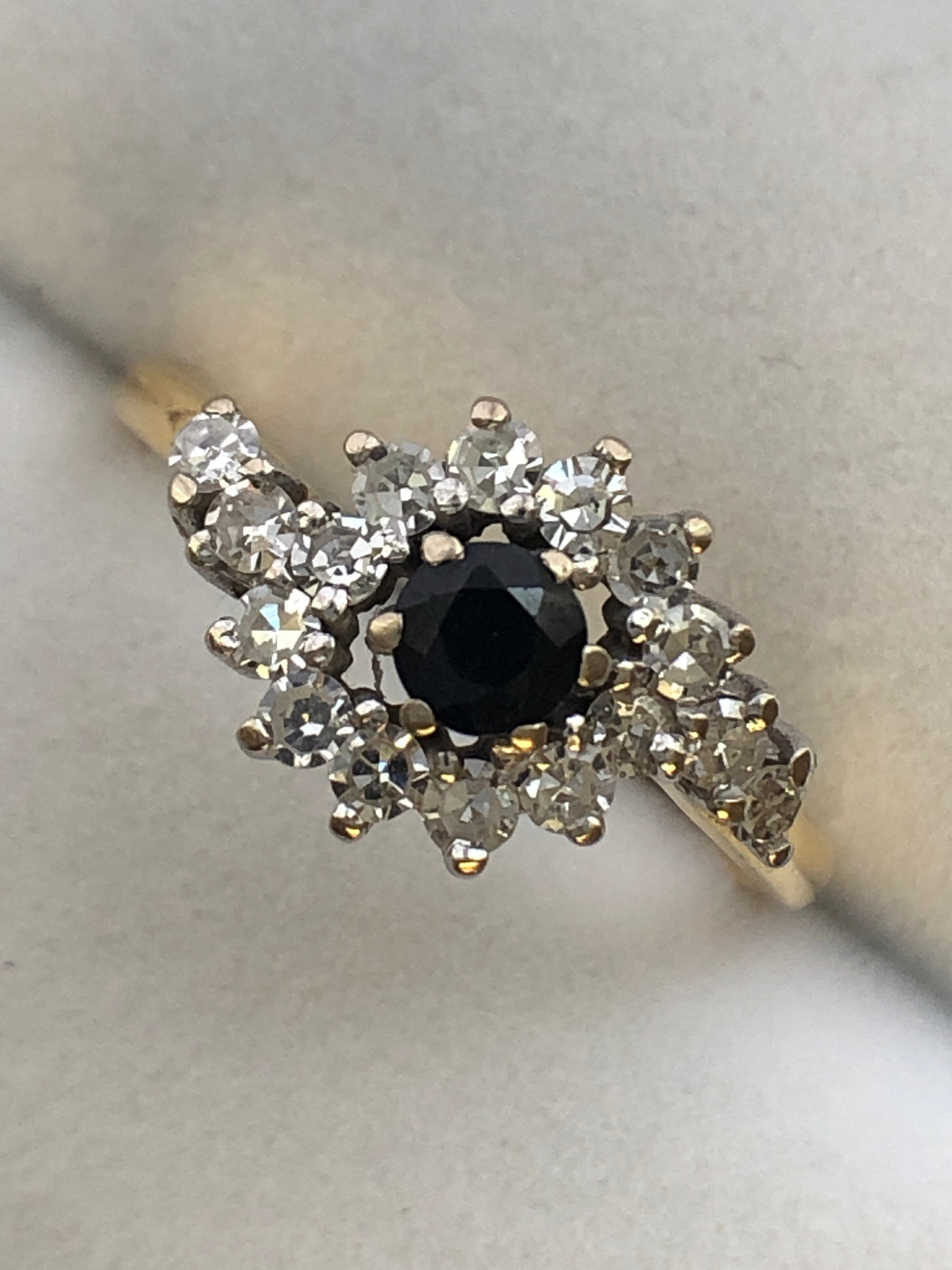An 18ct gold sapphire and diamond ring