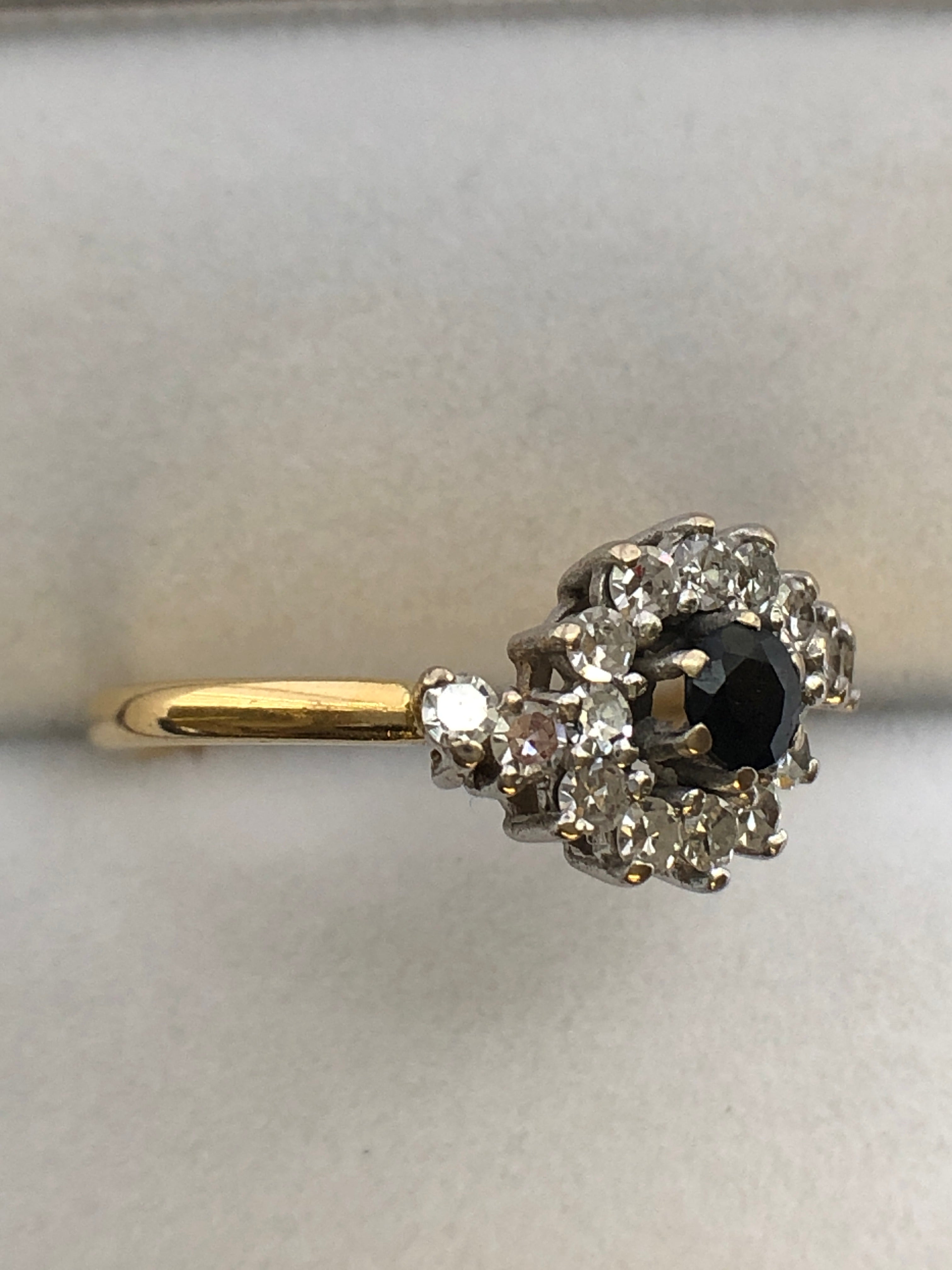 An 18ct gold sapphire and diamond ring