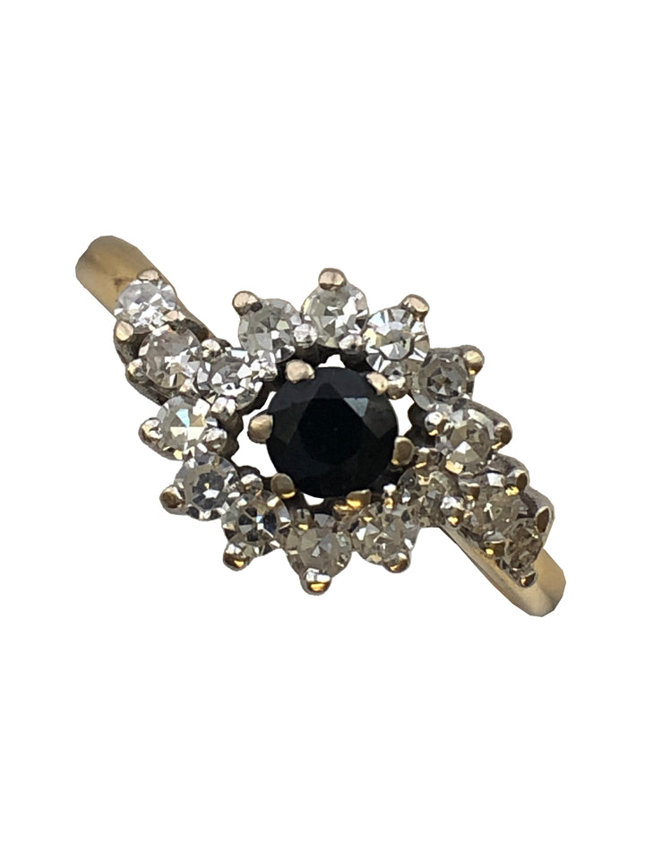 An 18ct gold sapphire and diamond ring