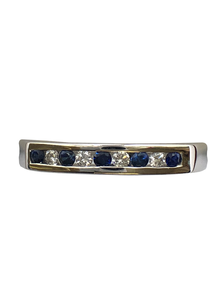 A 9ct white gold sapphire and diamond half eternity ring