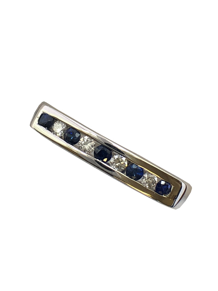 A 9ct white gold sapphire and diamond half eternity ring