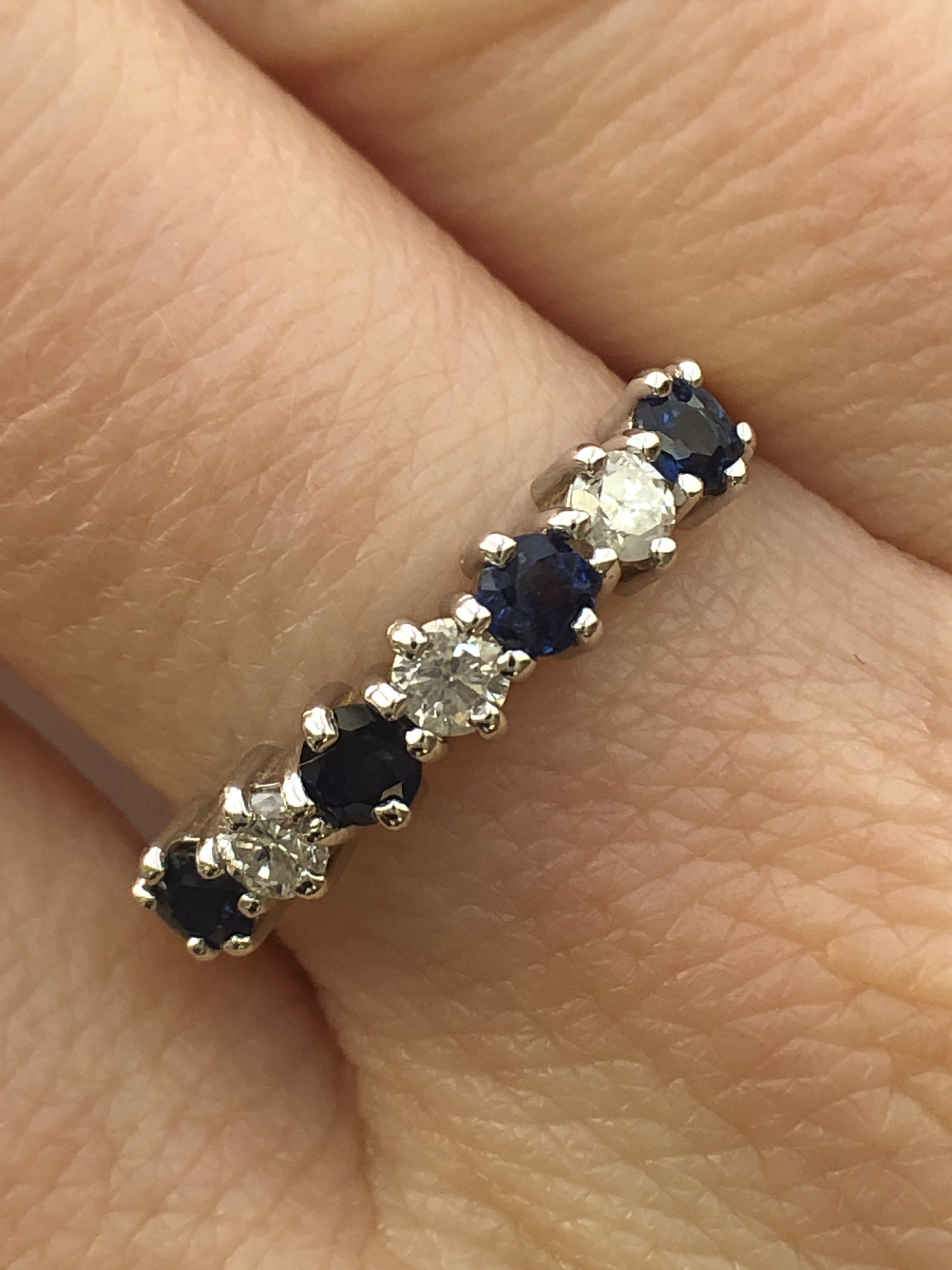 An 18ct gold sapphire and diamond seven stone ring