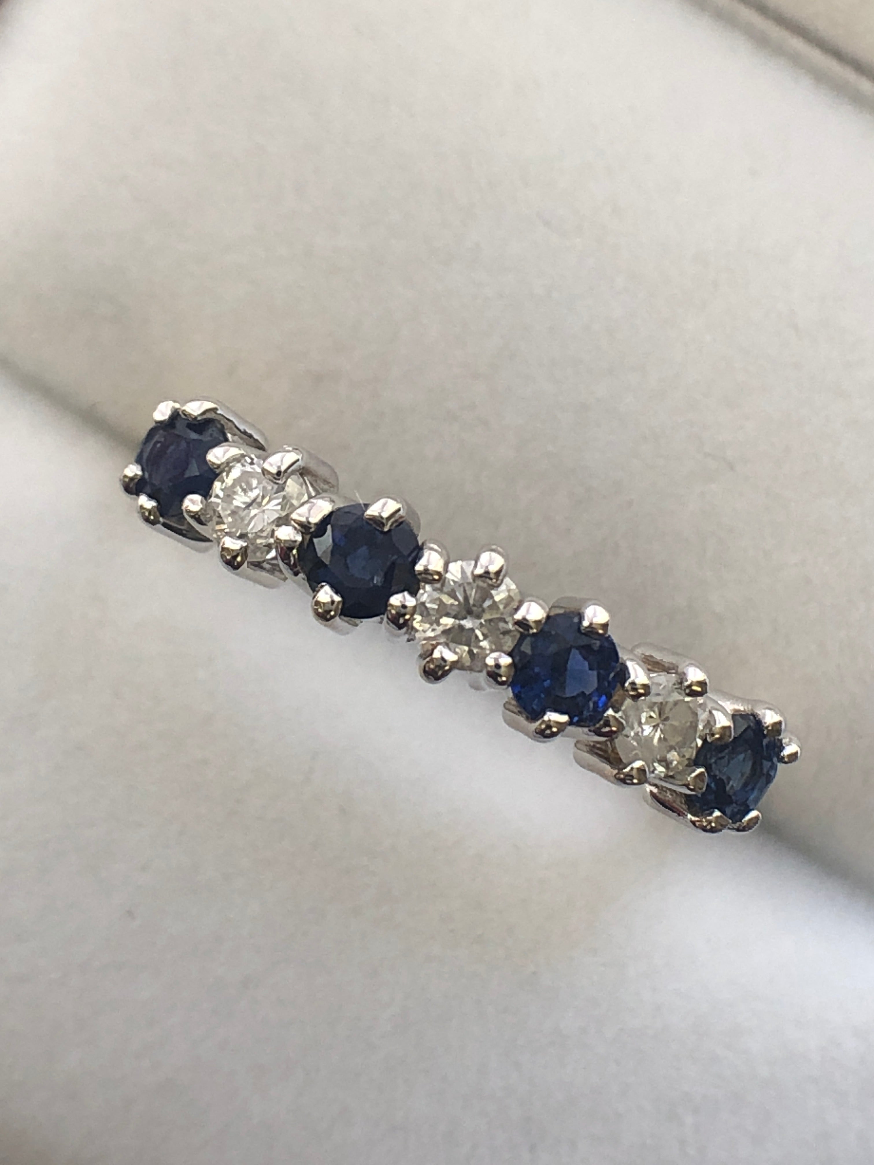 An 18ct gold sapphire and diamond seven stone ring