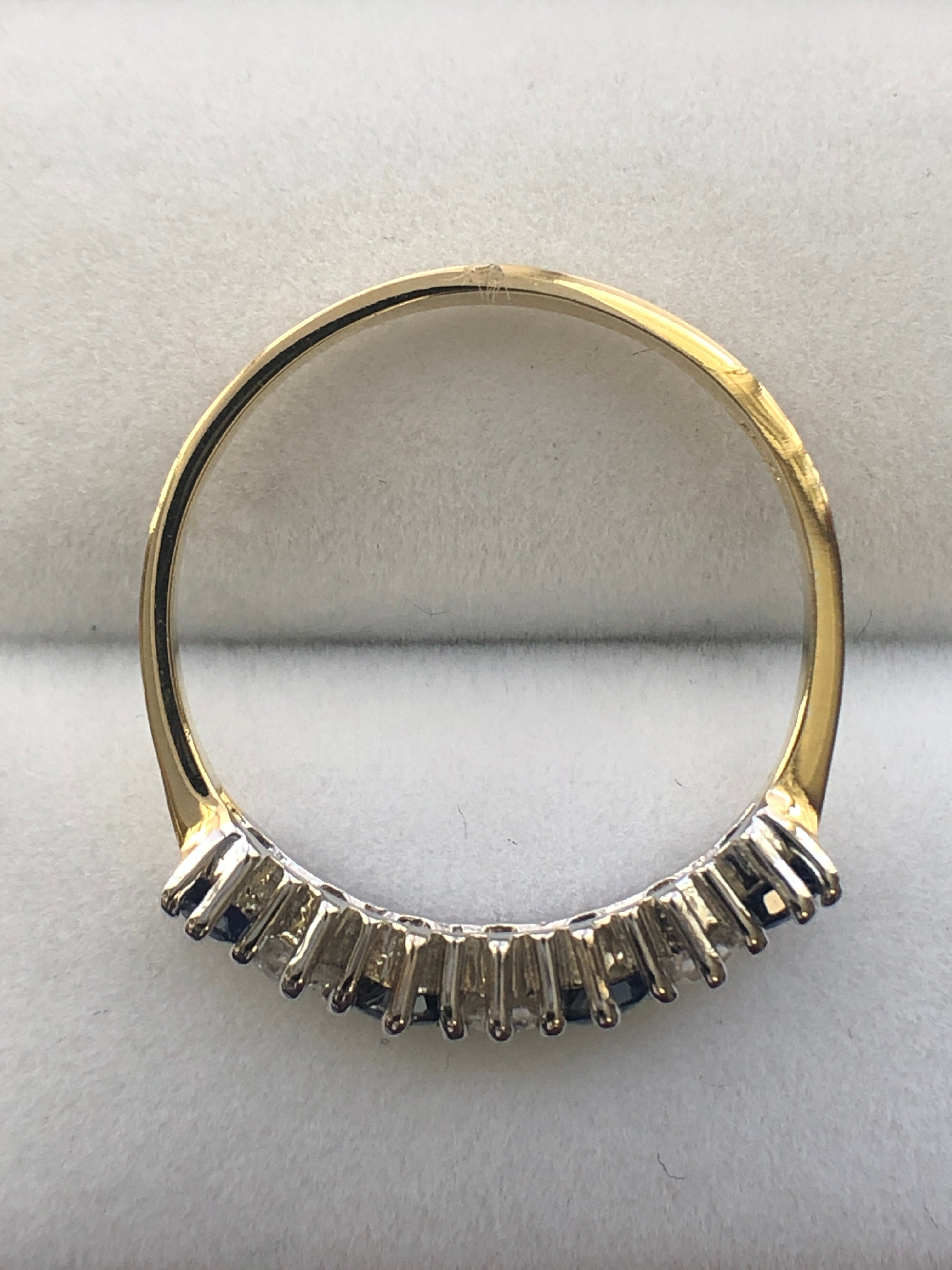 An 18ct gold sapphire and diamond seven stone ring