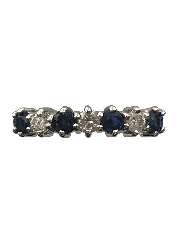An 18ct gold sapphire and diamond seven stone ring