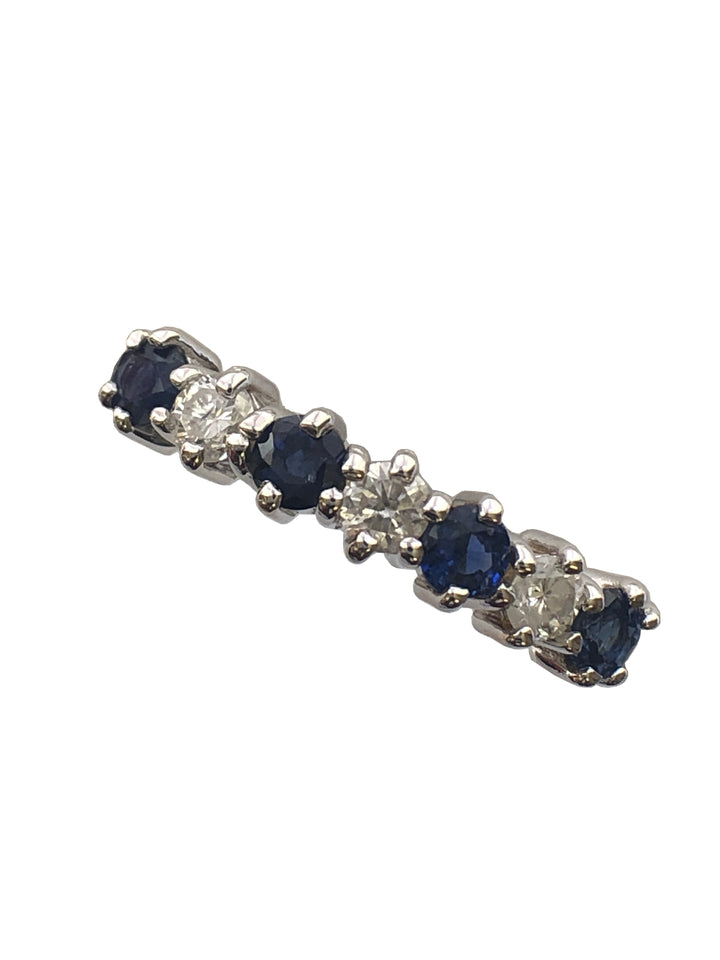 An 18ct gold sapphire and diamond seven stone ring