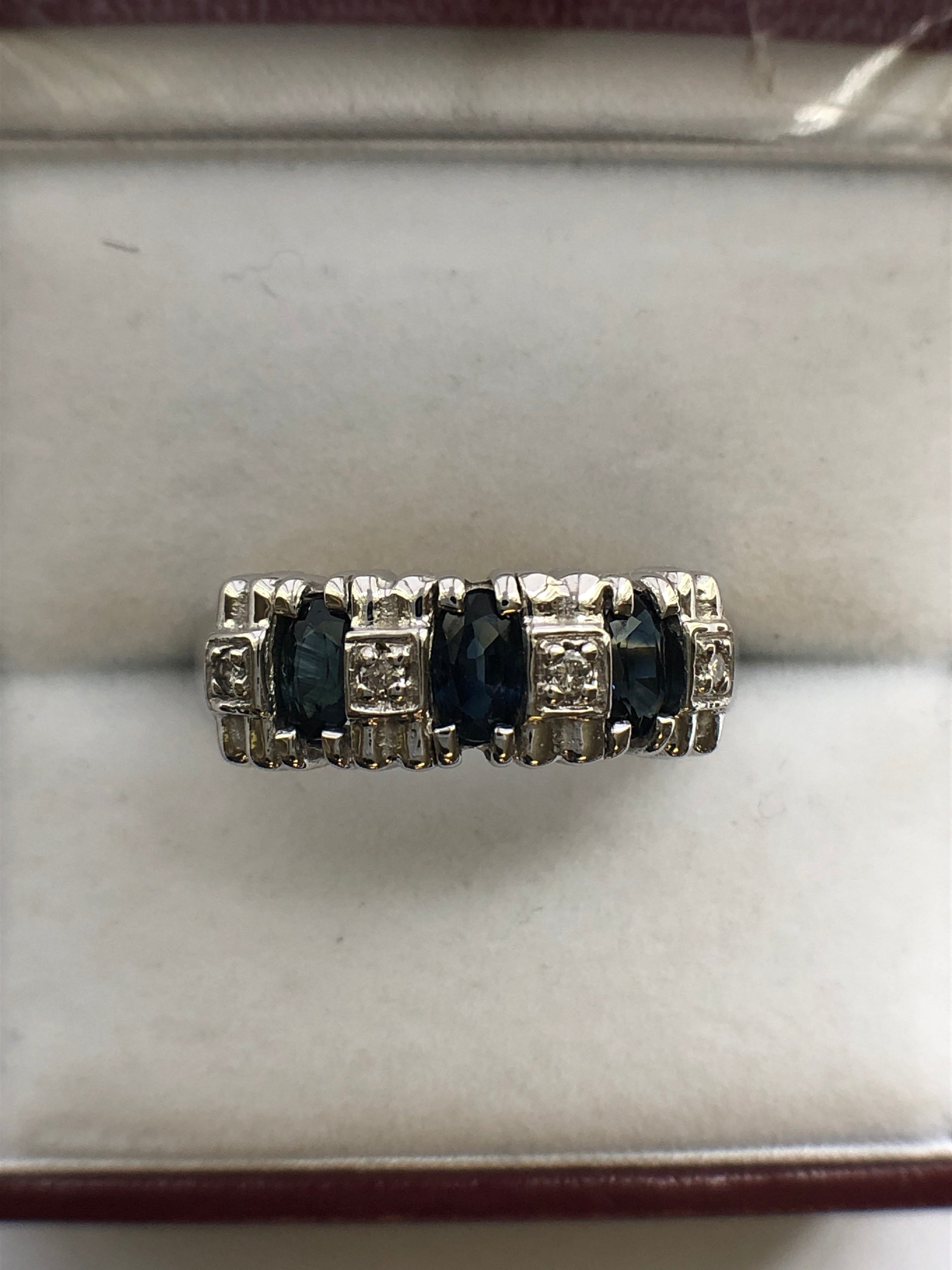 A 14ct white gold sapphire and diamond ring