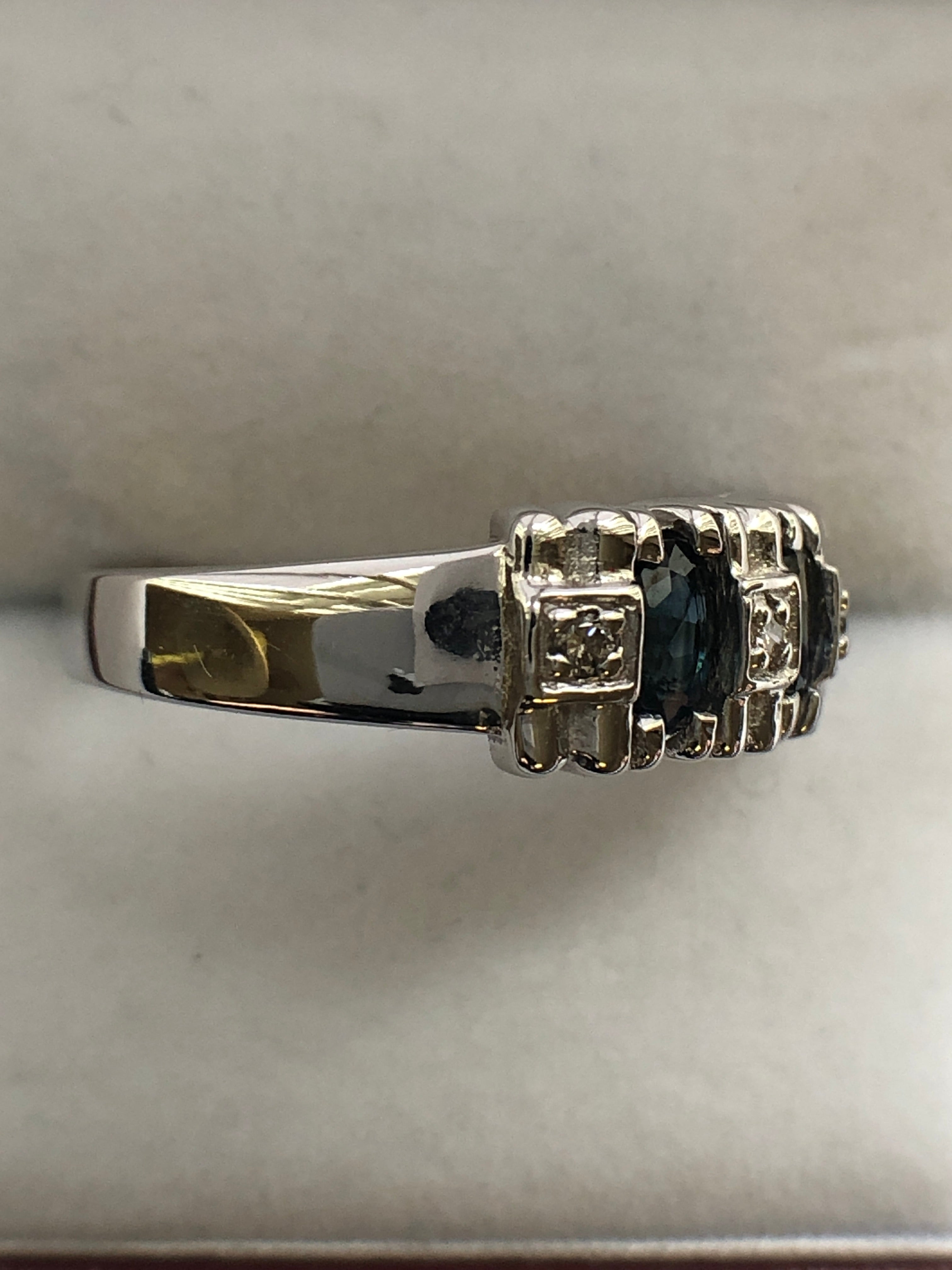 A 14ct white gold sapphire and diamond ring