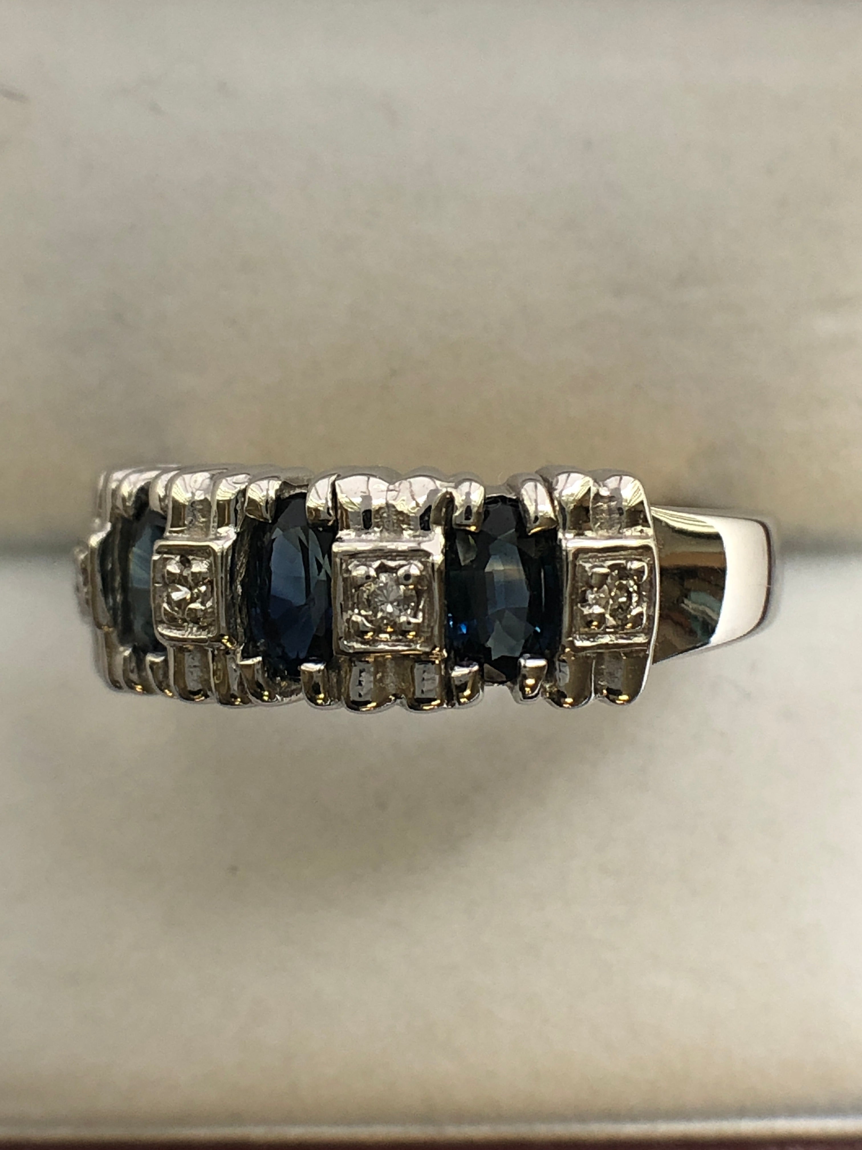 A 14ct white gold sapphire and diamond ring