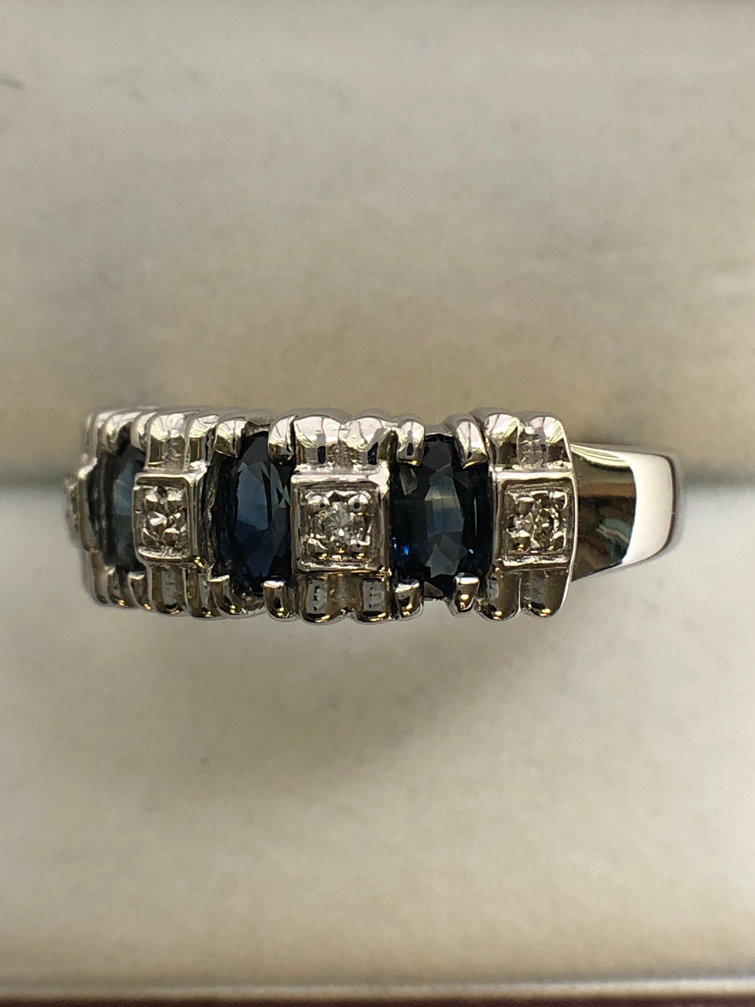 A 14ct white gold sapphire and diamond ring