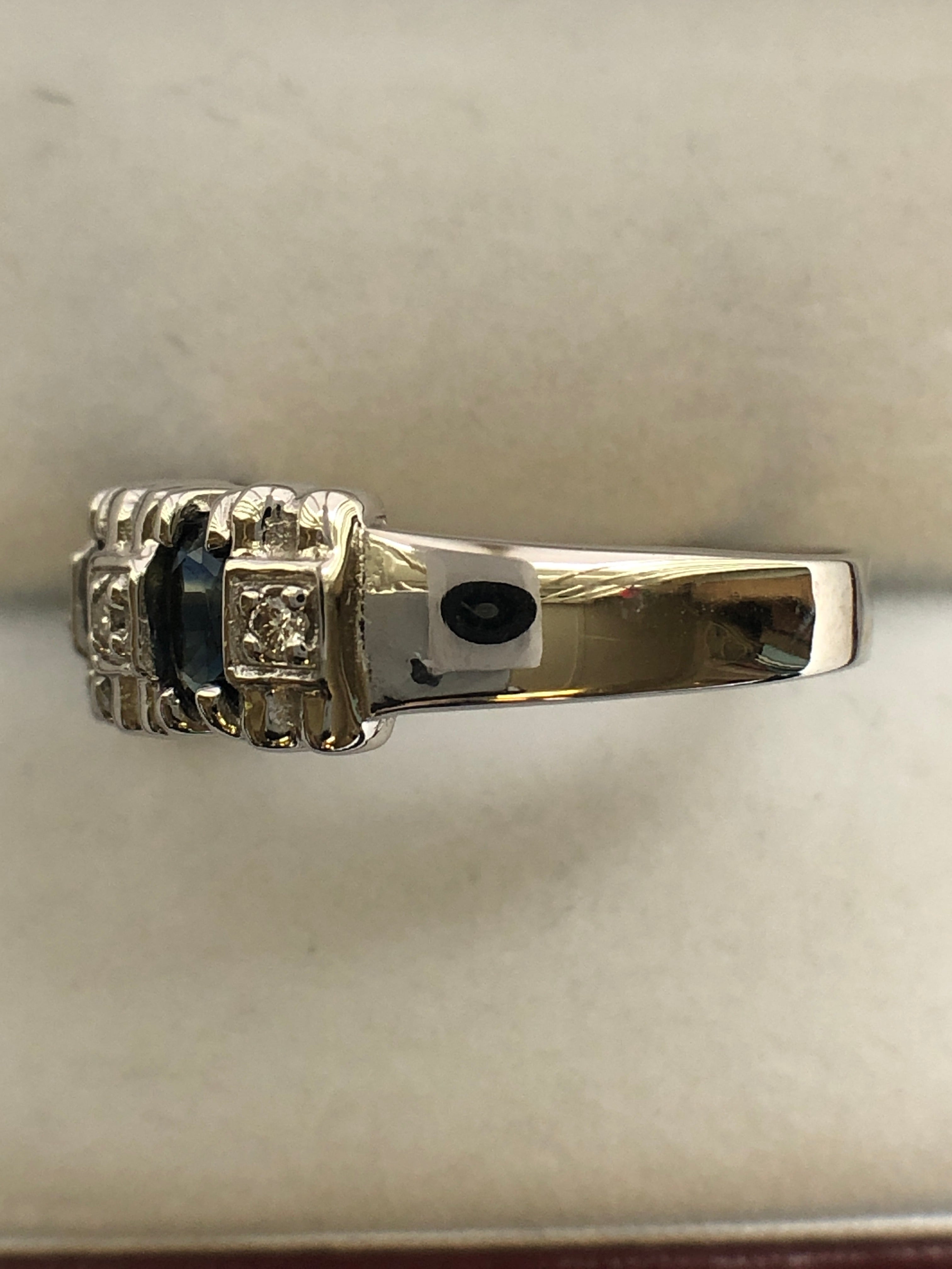 A 14ct white gold sapphire and diamond ring