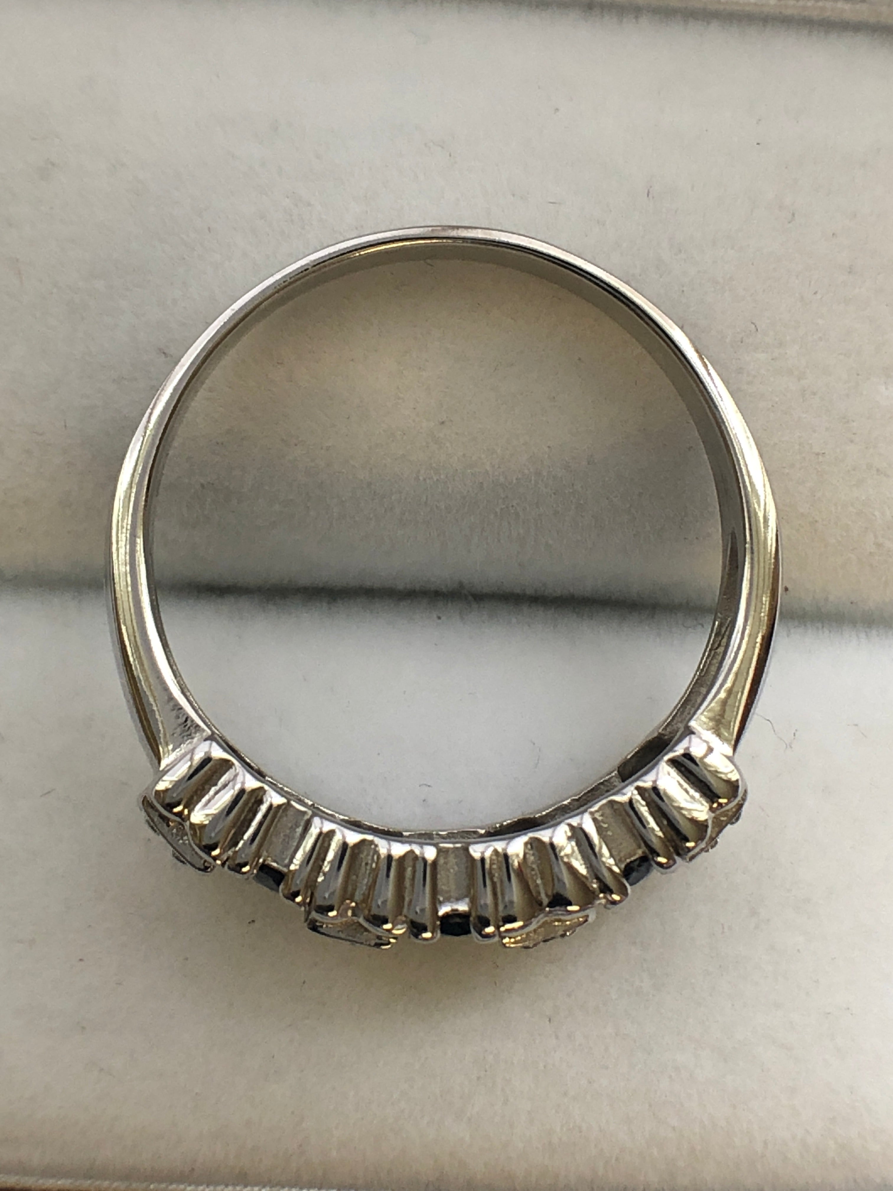 A 14ct white gold sapphire and diamond ring