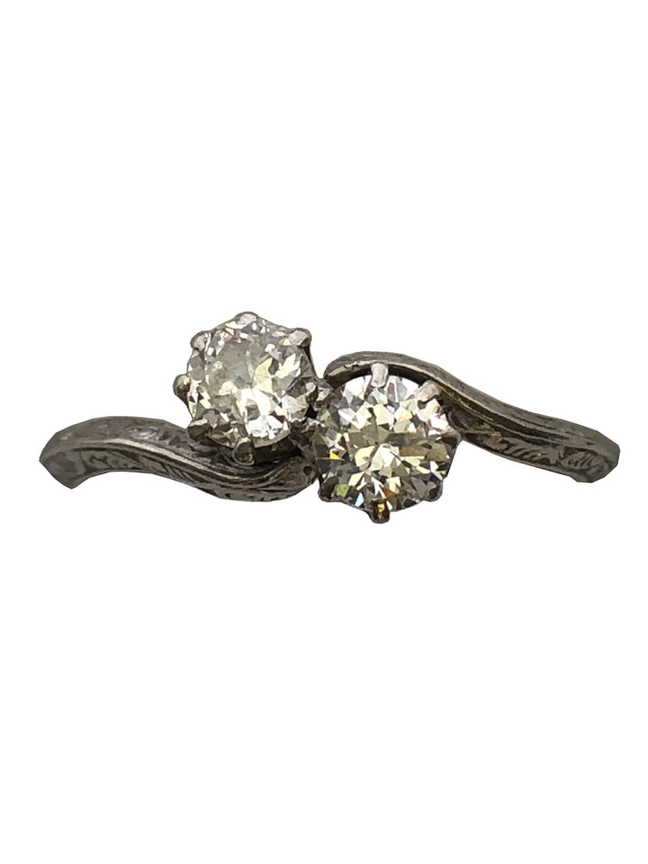 An antique platinum and diamond two stone twist ring
