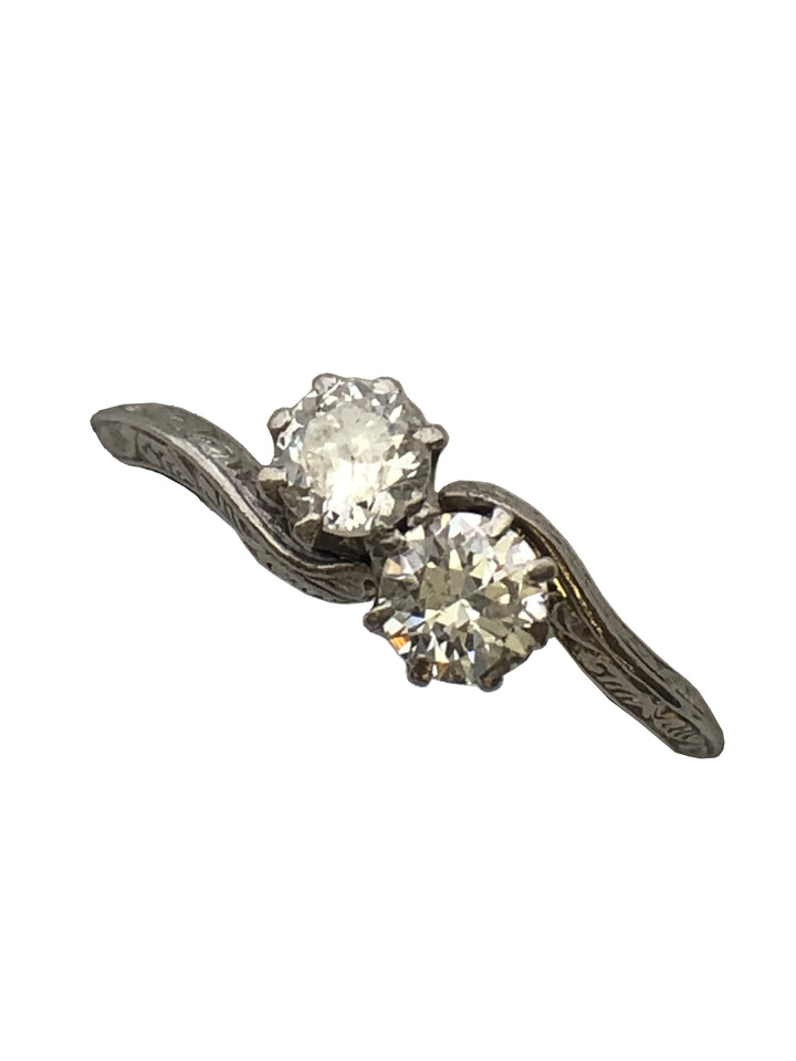 An antique platinum and diamond two stone twist ring