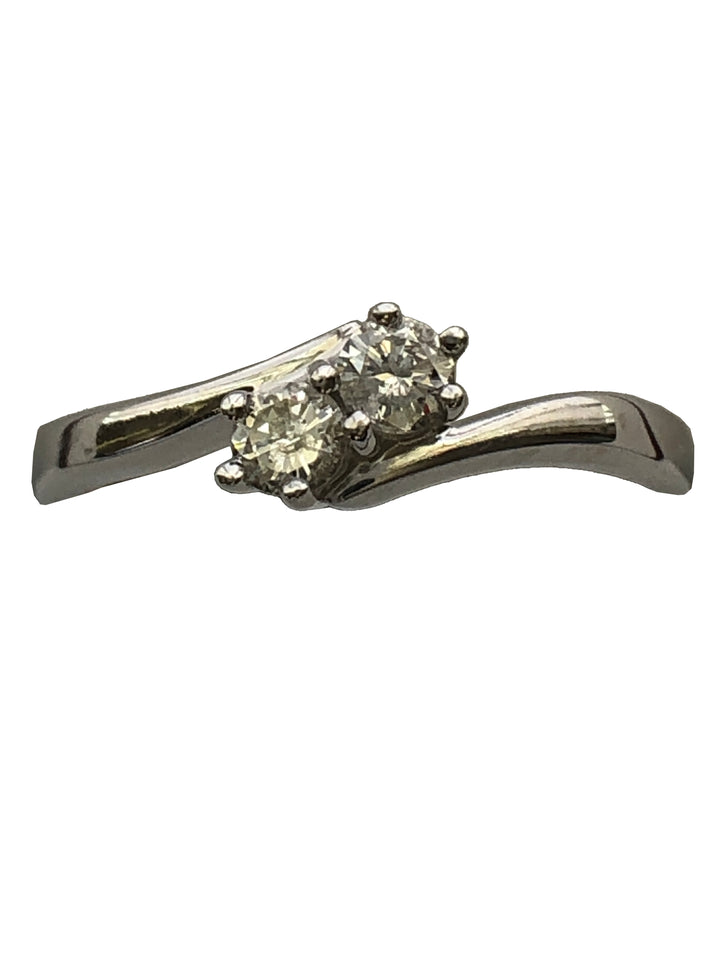 An 18ct white gold diamond two stone twist ring