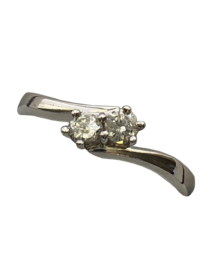 An 18ct white gold diamond two stone twist ring