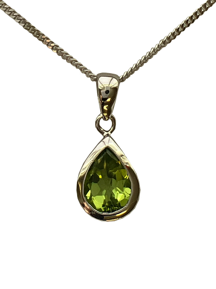 A 9ct white gold peridot pendant