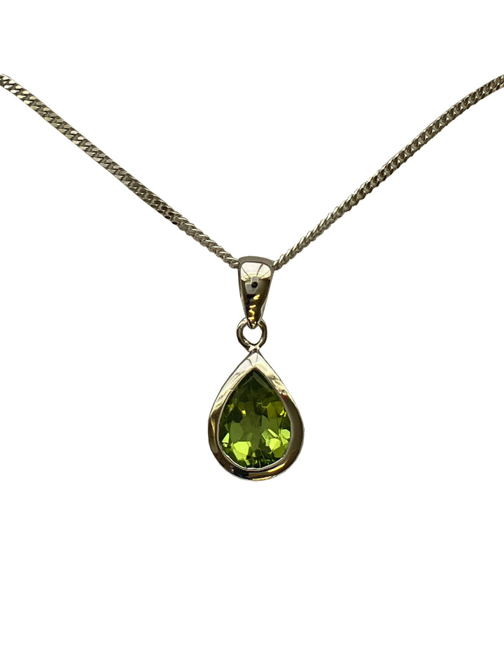 A 9ct white gold peridot pendant
