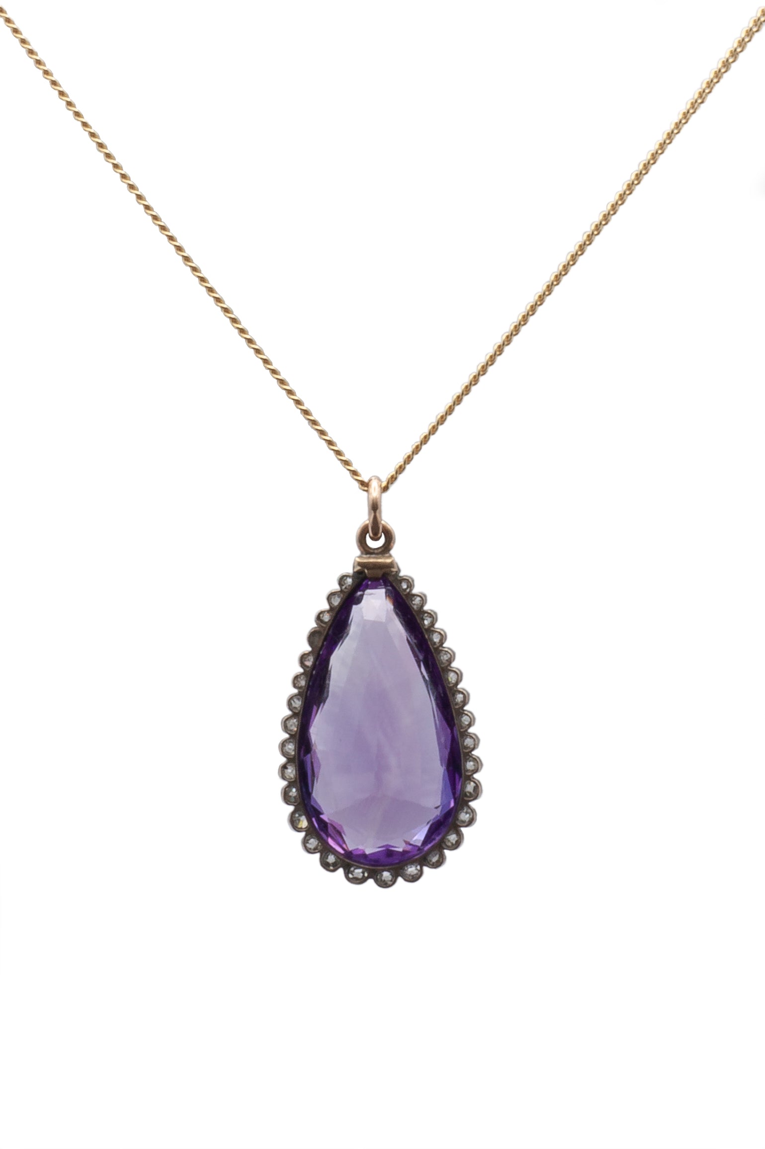 A 9ct yellow gold and silver amethyst and diamond pendant.