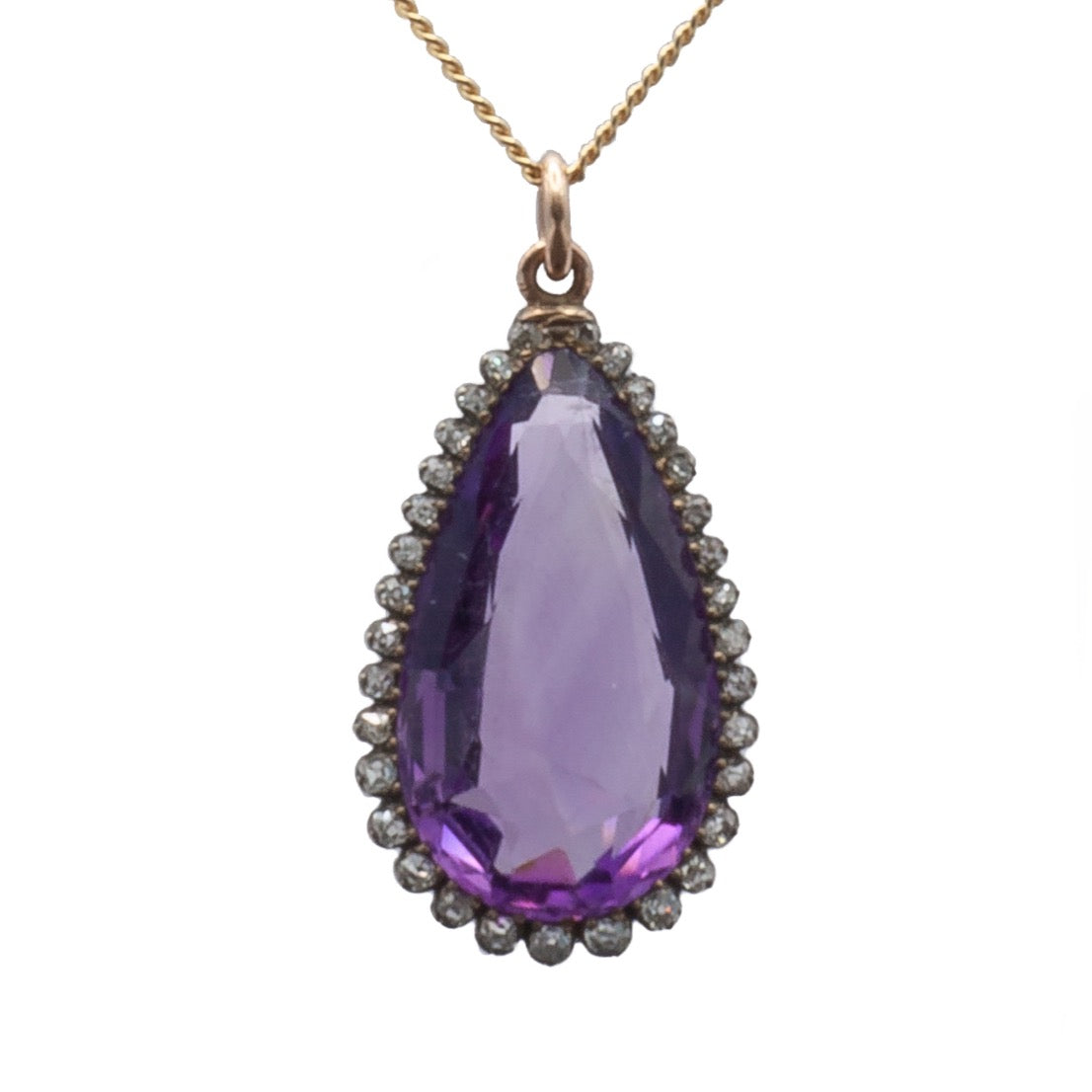 A 9ct yellow gold and silver amethyst and diamond pendant.