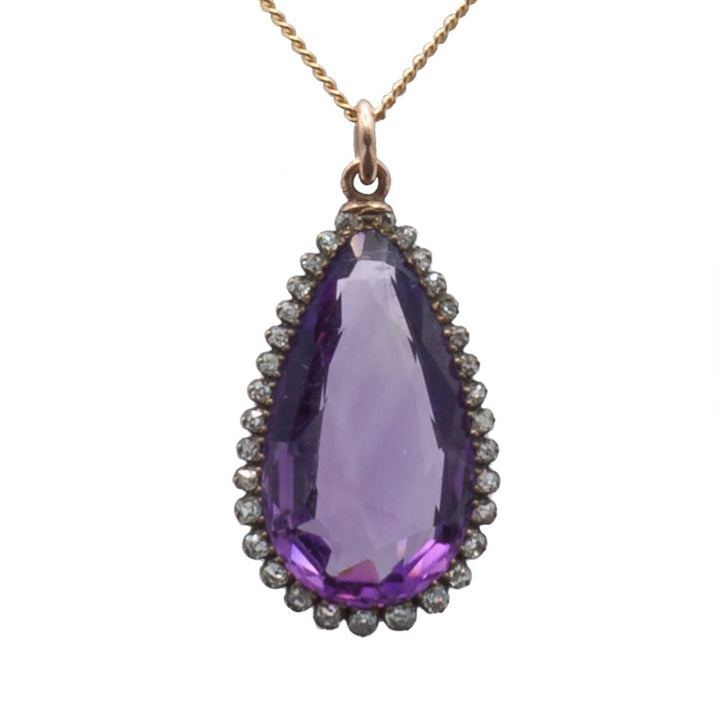 A 9ct yellow gold and silver amethyst and diamond pendant.