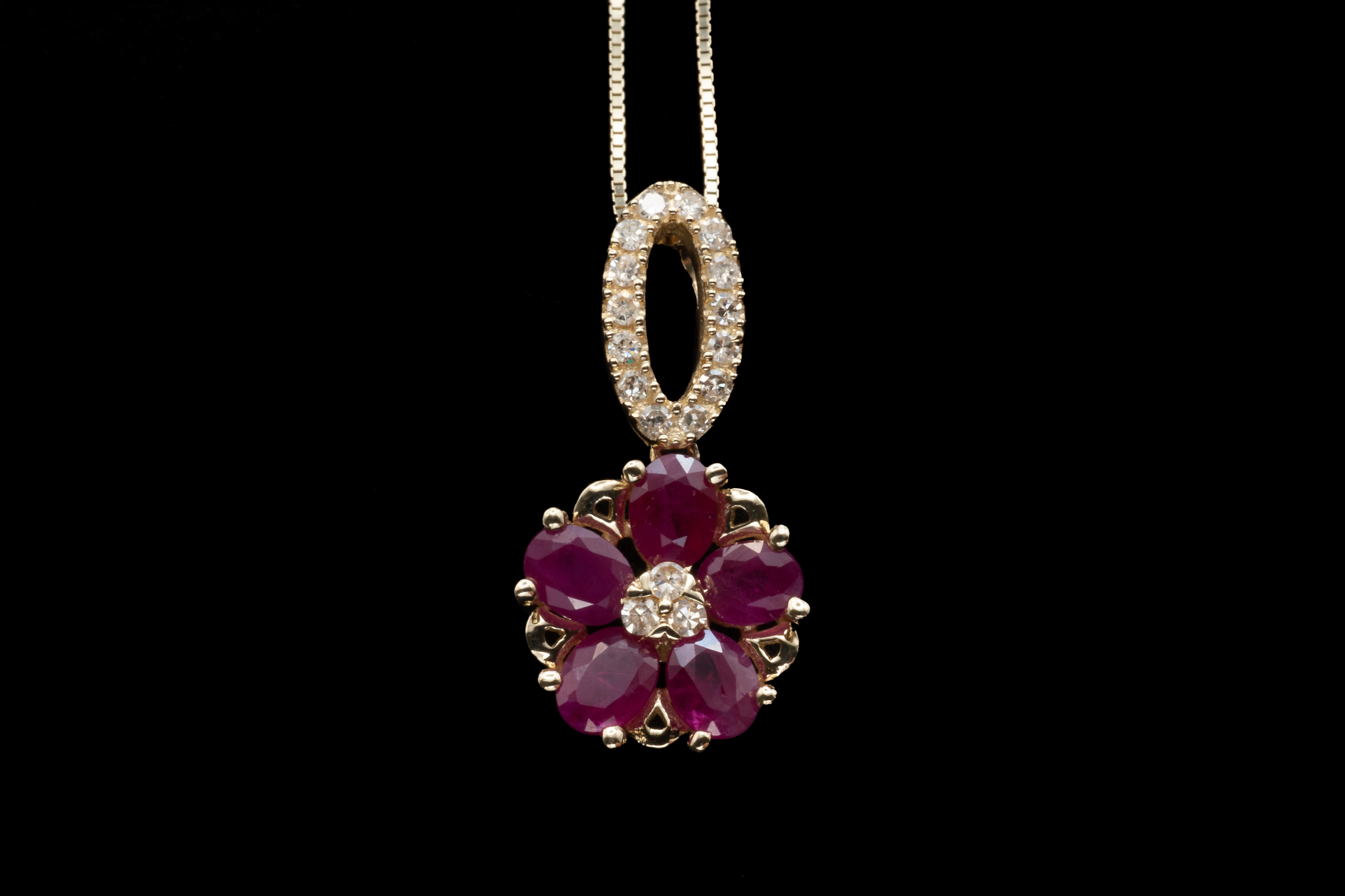 A 14ct yellow gold ruby and diamond pendant.