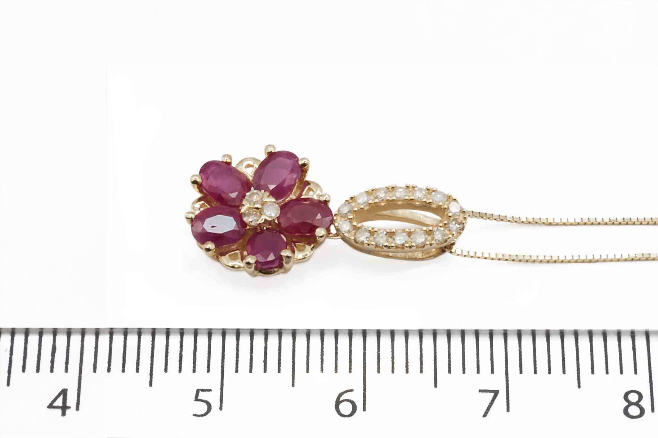 A 14ct yellow gold ruby and diamond pendant.