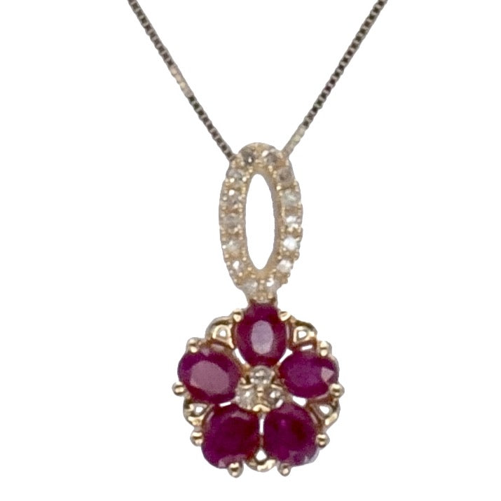 A 14ct yellow gold ruby and diamond pendant.
