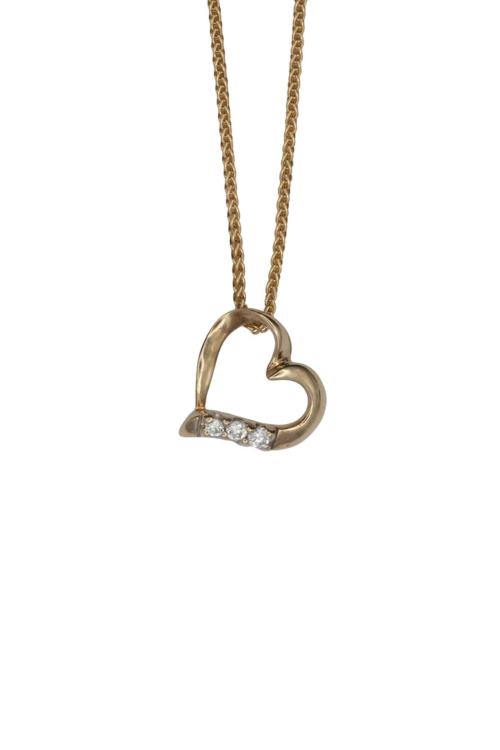 A 9ct gold cubic zirconia heart pendant on a 9ct gold chain
