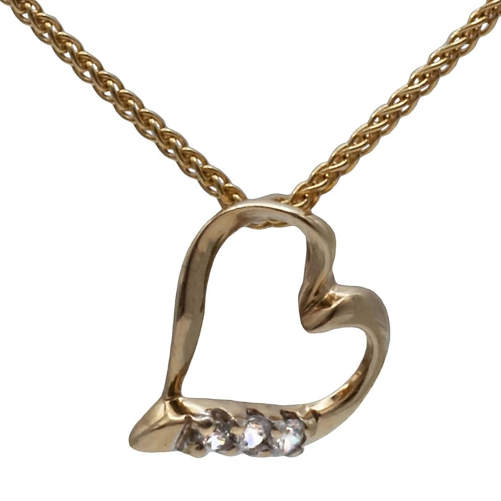 A 9ct gold cubic zirconia heart pendant on a 9ct gold chain