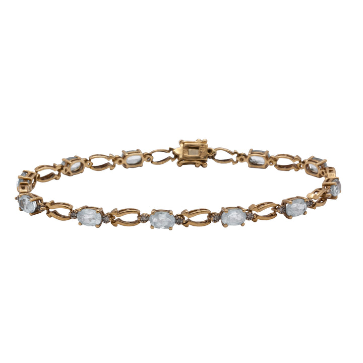 A 9ct gold blue topaz and diamond bracelet
